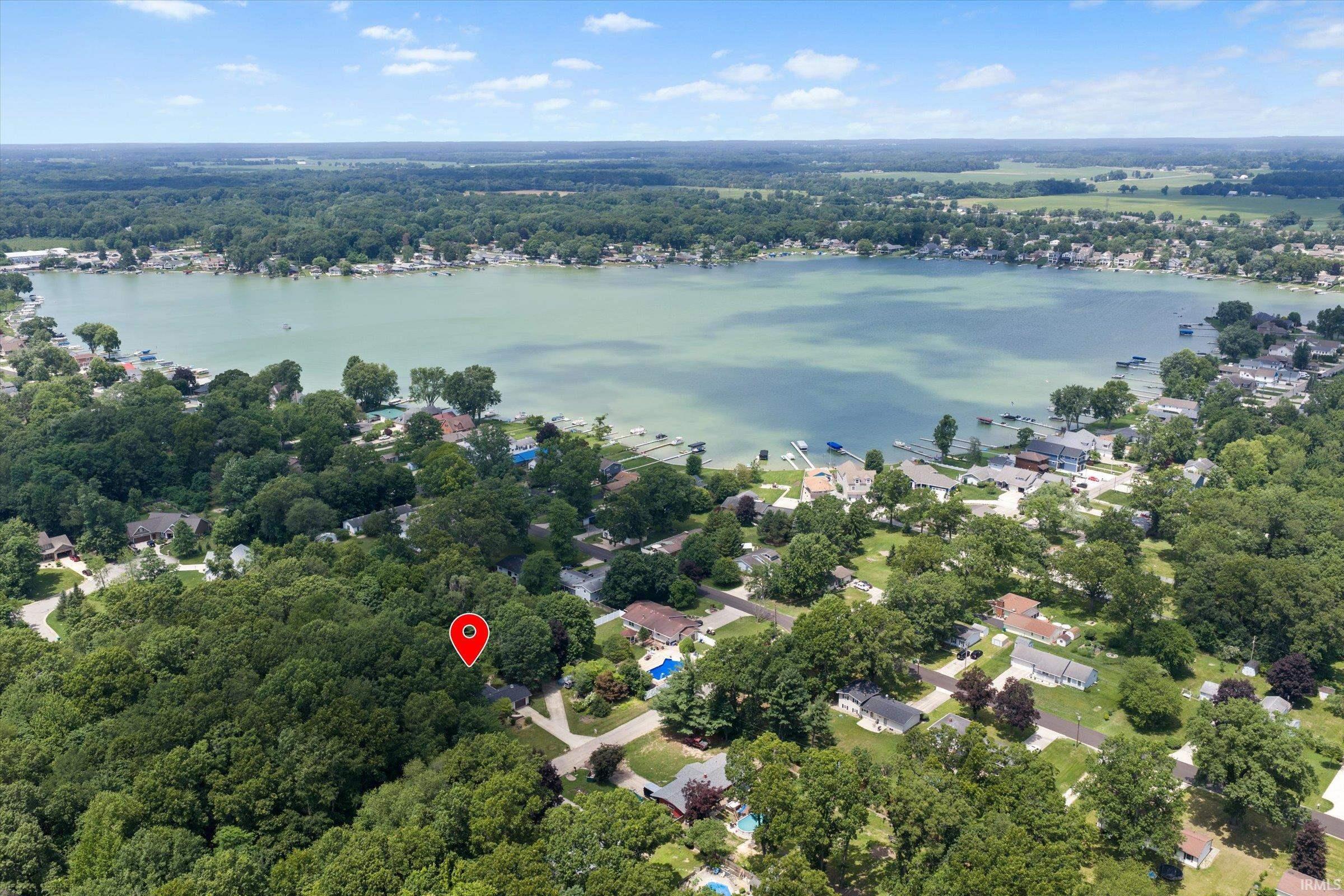 Image 3: Aerial perspective showcasing a large body of water bordered by residential properties, Aerial View Image 3: Aerial perspective showcasing a large body of water bordered by residential properties, Aerial View