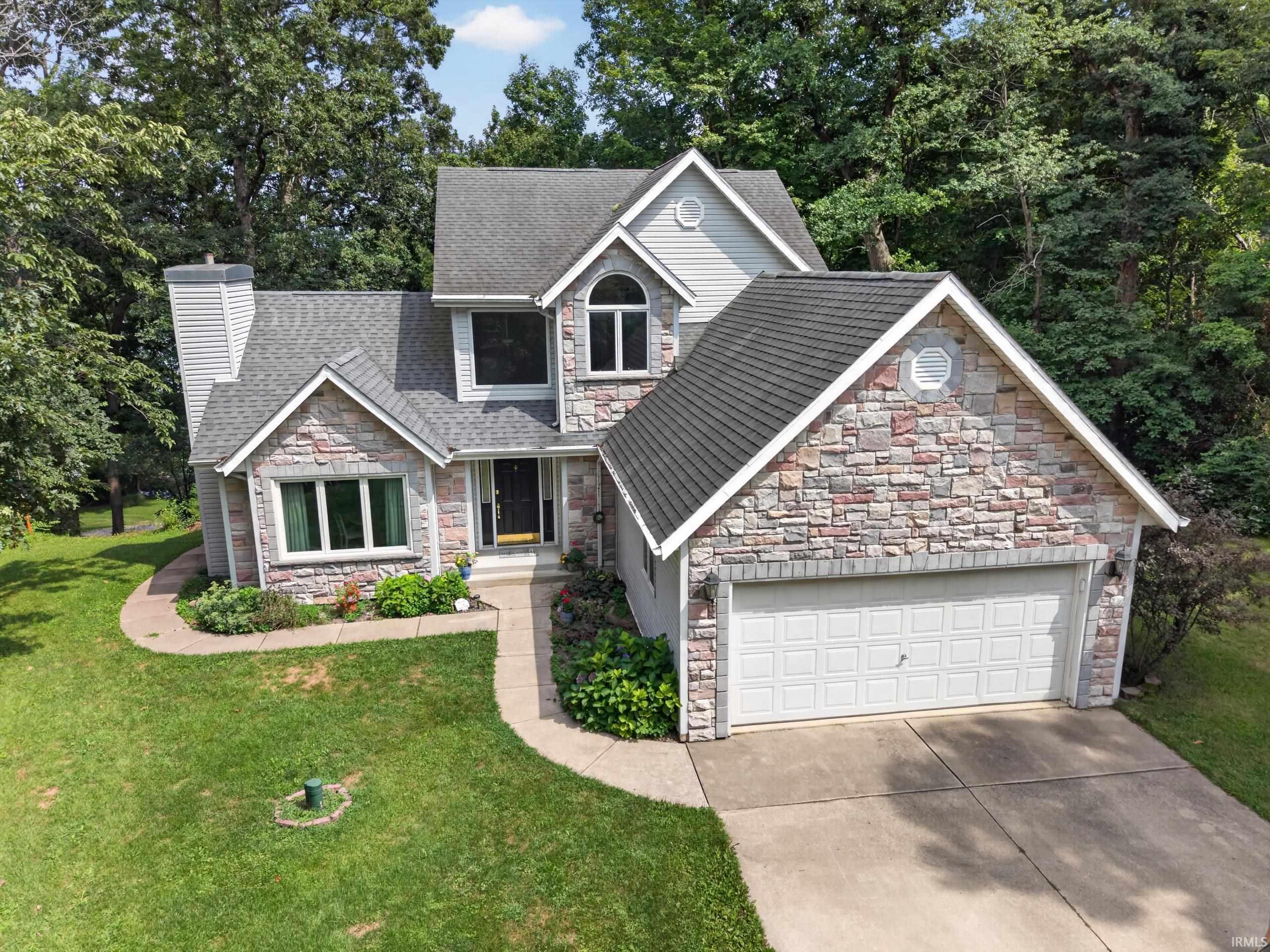 Image 2: Stone and siding exterior with a gabled roof, Front Of Structure Image 2: Stone and siding exterior with a gabled roof, Front Of Structure
