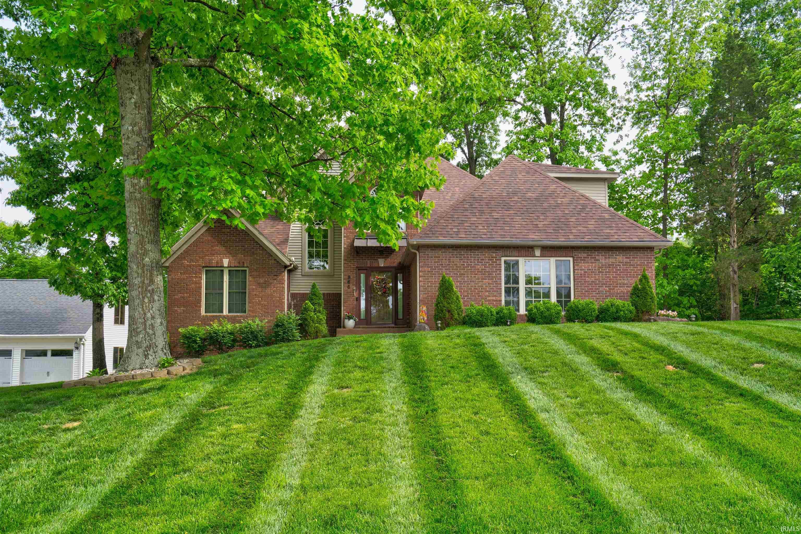 Image 1: Brick and siding exterior with a pitched roof and multiple gables, Front Of Structure Image 1: Brick and siding exterior with a pitched roof and multiple gables, Front Of Structure