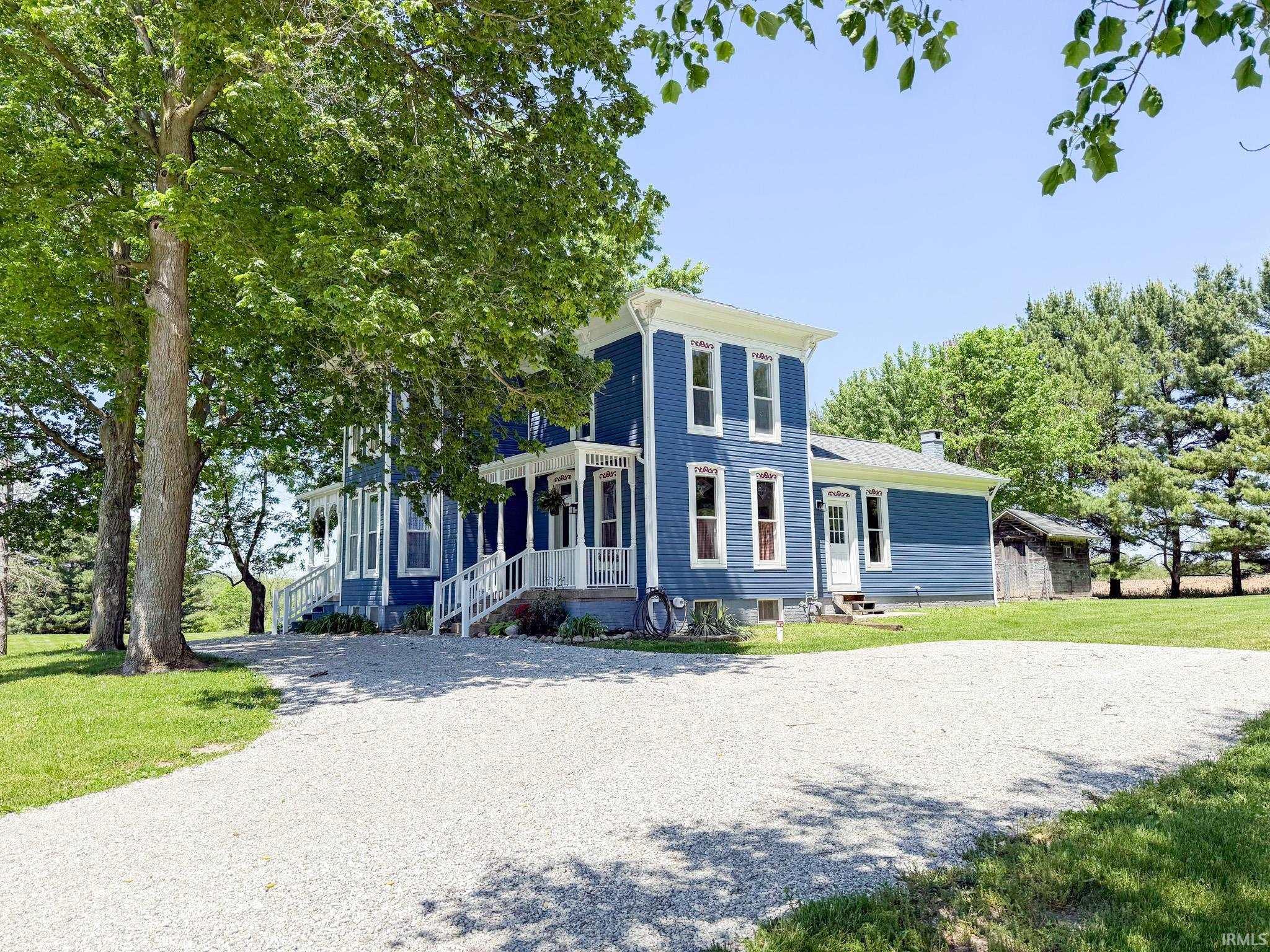 Image 1: Blue exterior with white trim, Front Of Structure Image 1: Blue exterior with white trim, Front Of Structure