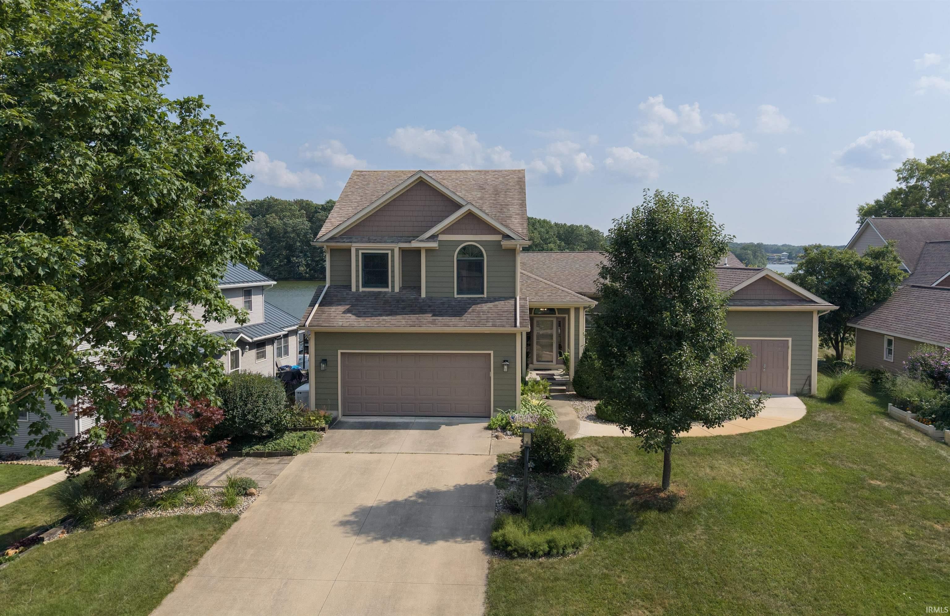 Image 3: Multi-level residence featuring a two-car garage and an additional single-car garage, Front Of Structure Image 3: Multi-level residence featuring a two-car garage and an additional single-car garage, Front Of Structure
