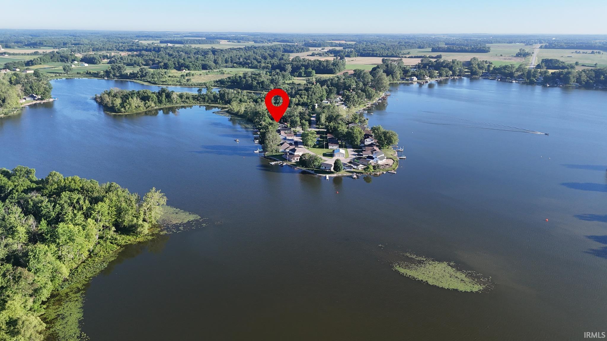 Image 1: Expansive lakefront property situated on a peninsula, featuring multiple residences and private boat docks, Aerial View Image 1: Expansive lakefront property situated on a peninsula, featuring multiple residences and private boat docks, Aerial View