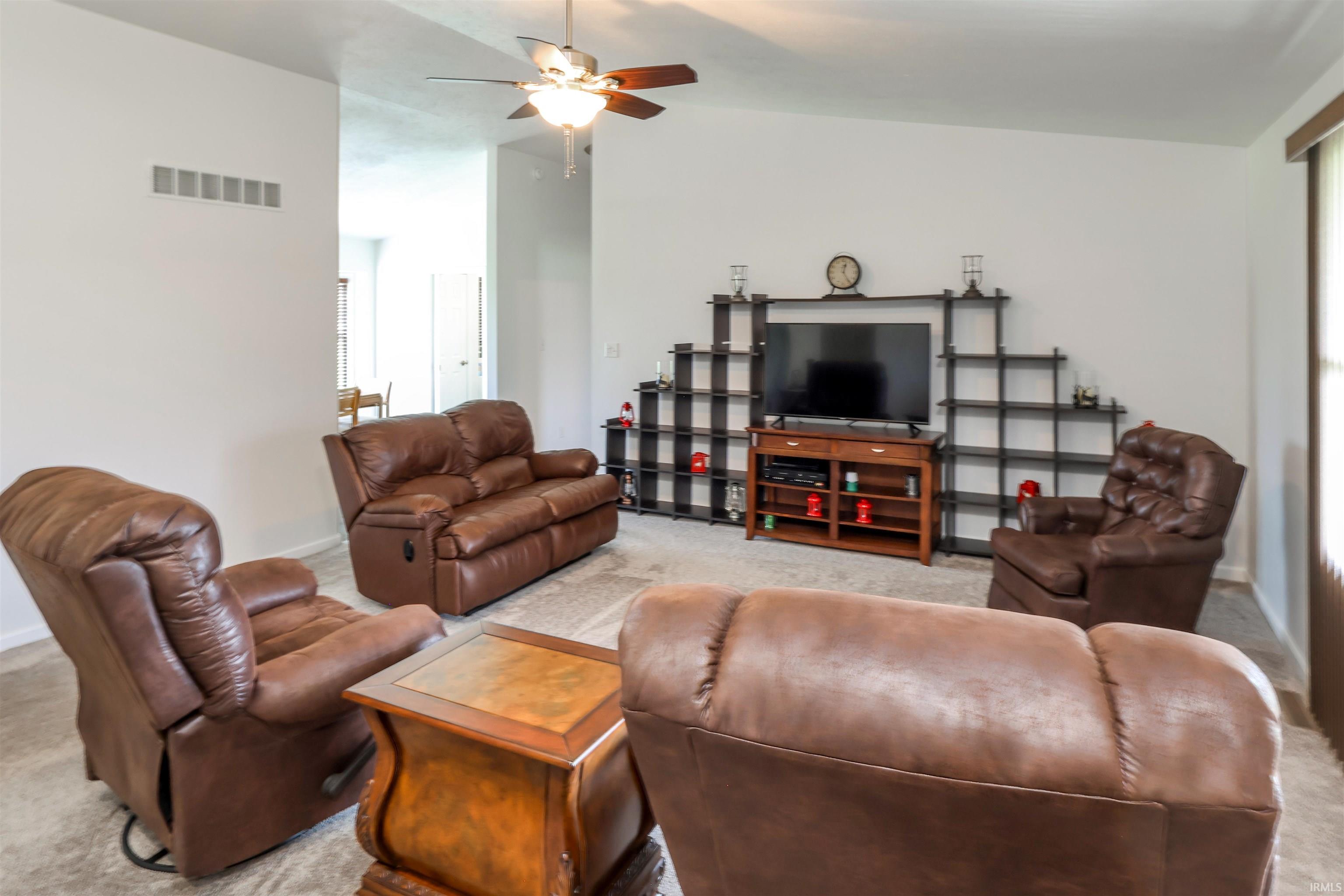 Image 2: Living room featuring carpet, lofted ceiling, and ceiling fan, Living Room