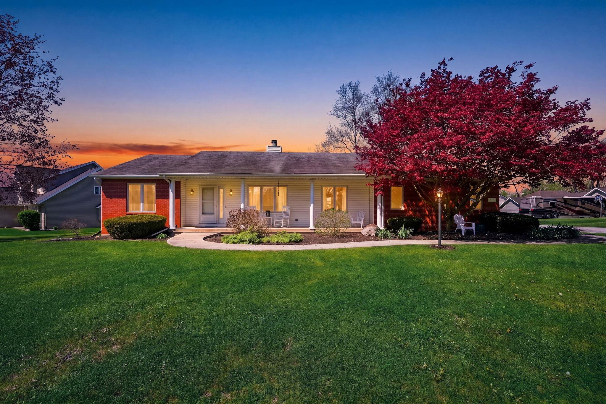 Image 0: Ranch-style residence featuring a red brick facade and white siding, Front Of Structure Image 0: Ranch-style residence featuring a red brick facade and white siding, Front Of Structure