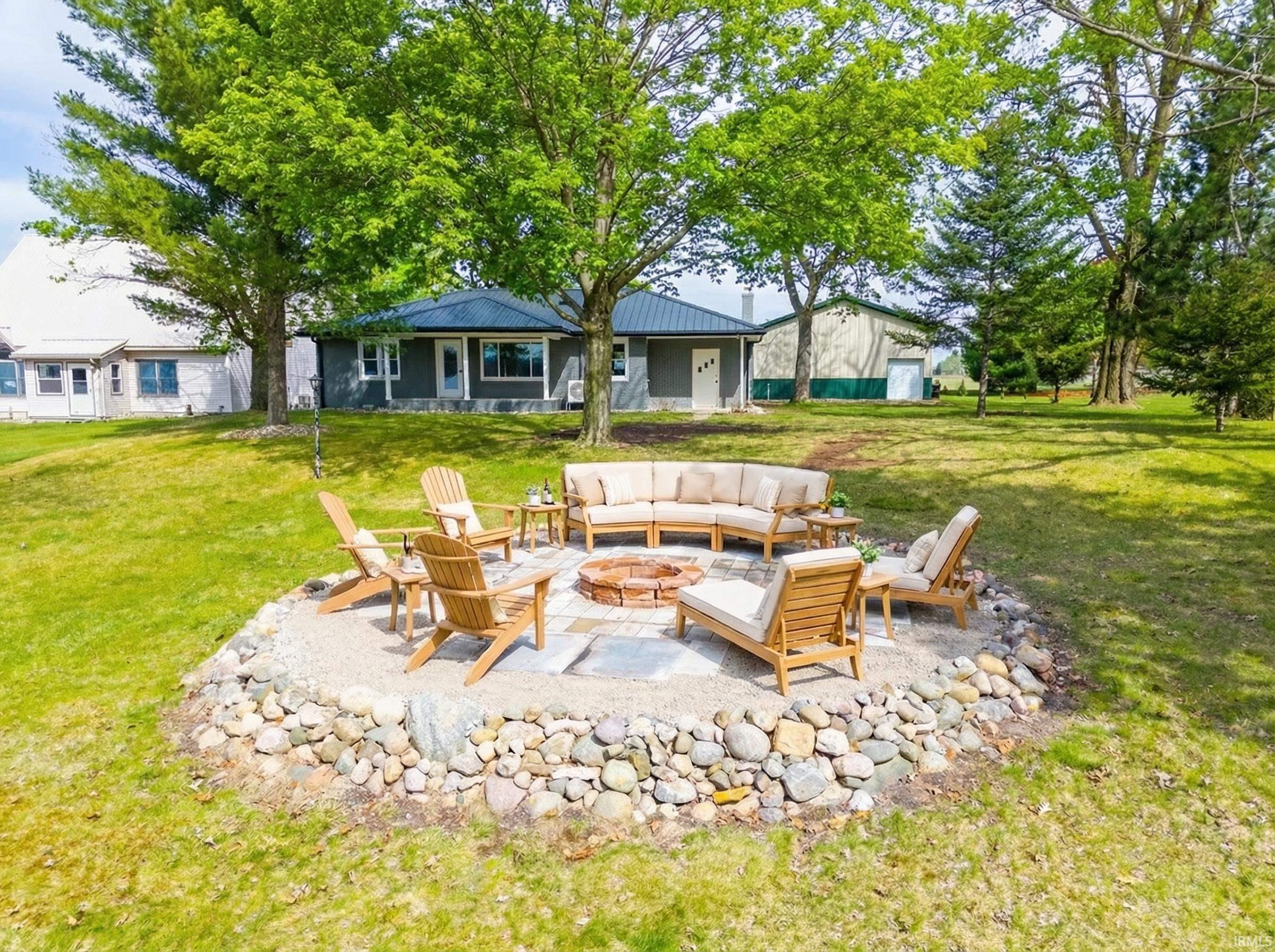 Image 1: Lakefront firepit view from lake