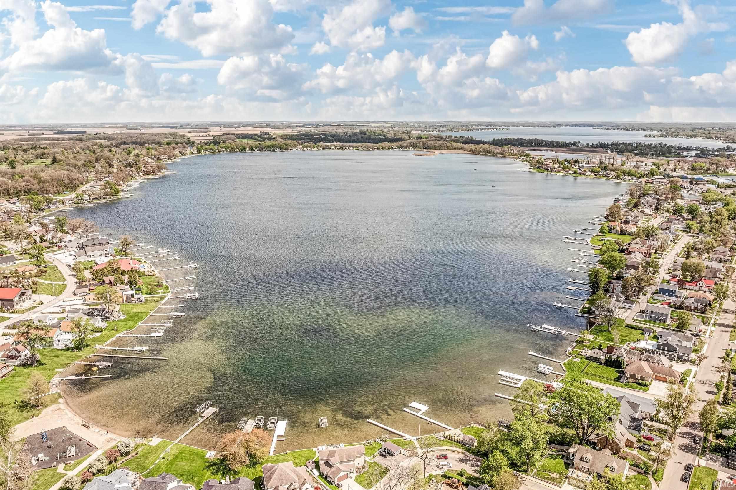 Image 1: Aerial perspective showcasing a significant body of water bordered by residential properties, View Image 1: Aerial perspective showcasing a significant body of water bordered by residential properties, View