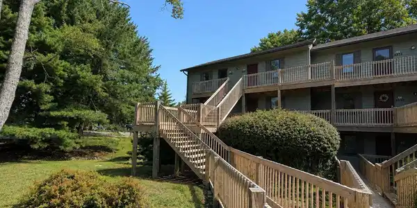 Image 1: Multi-level building exterior with wood siding, Front Of Structure Image 1: Multi-level building exterior with wood siding, Front Of Structure
