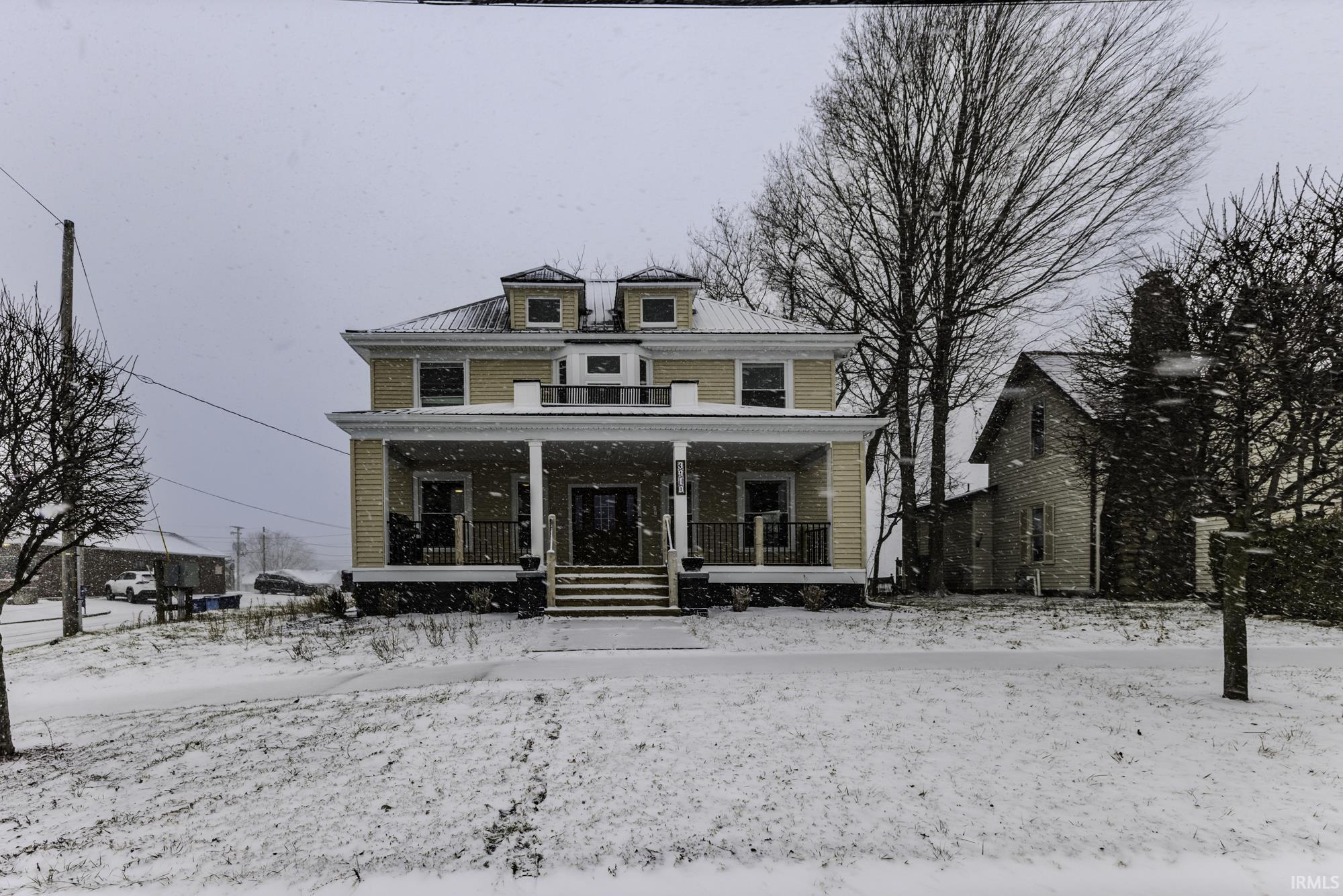 Image 0: Traditional style home featuring covered porch, Front Of Structure