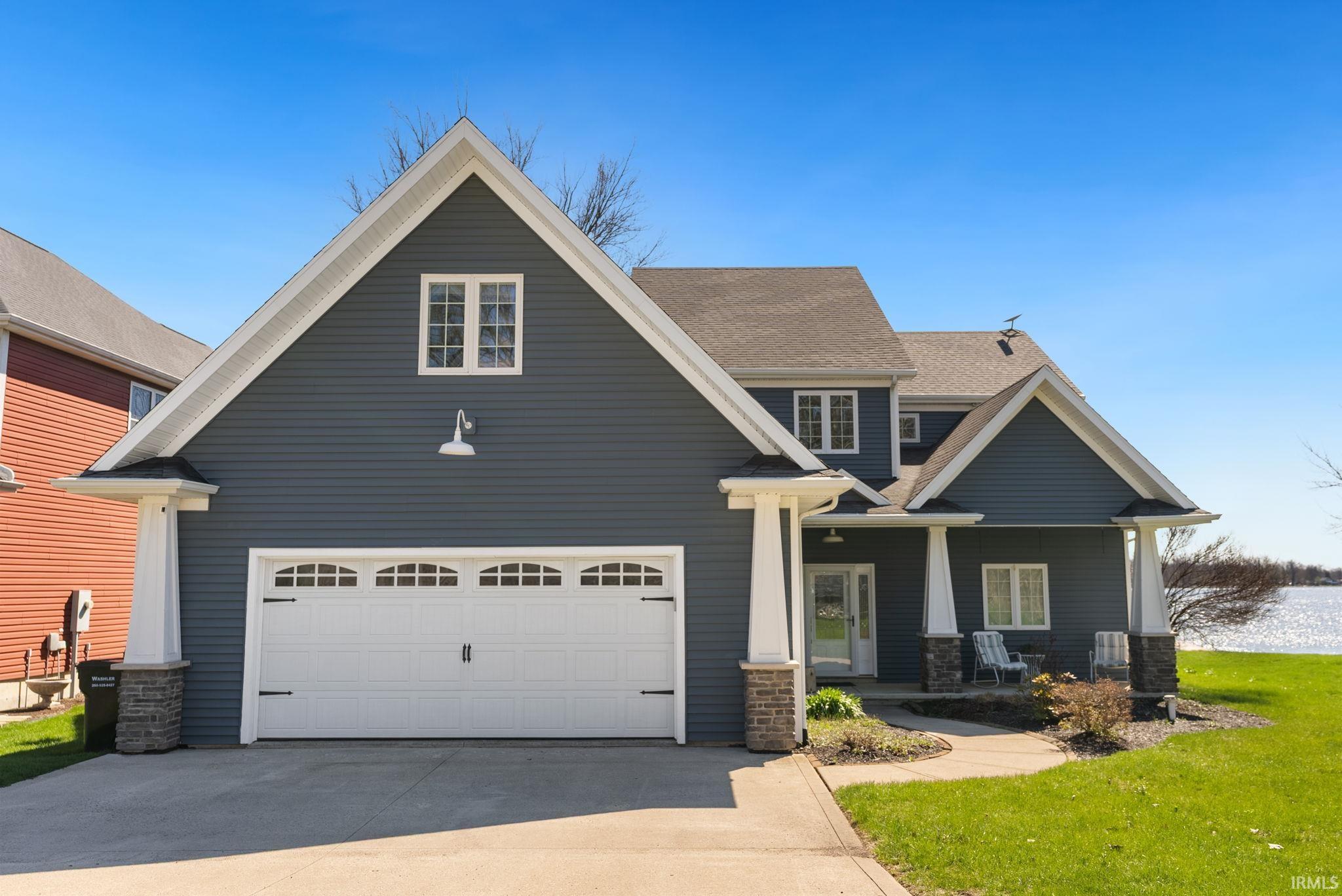 Image 1: Craftsman-style home with a porch, concrete driveway, a front yard, roof with shingles, and a garage, Front Of Structure