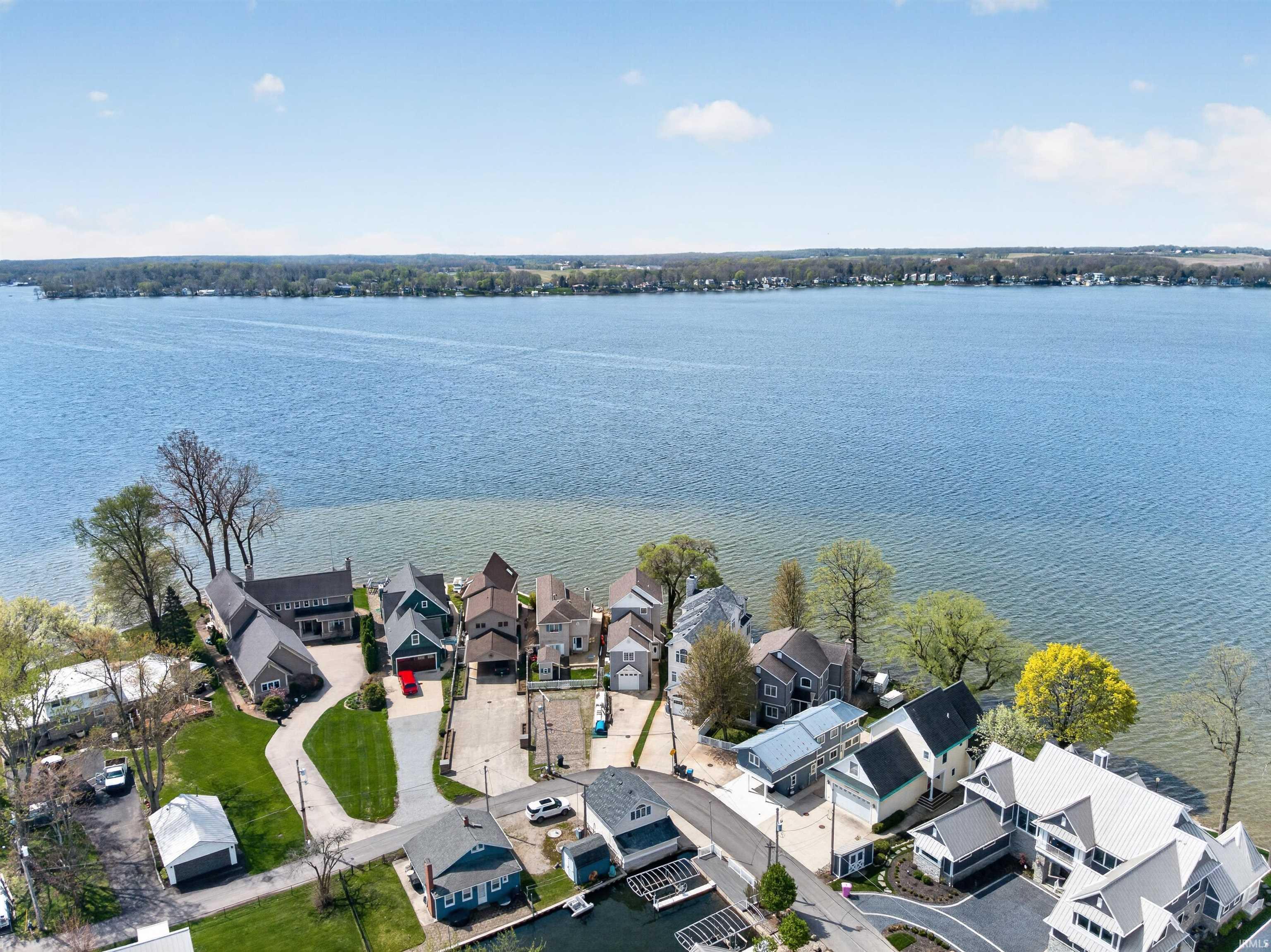 Image 2: Aerial view of residential area with a nearby body of water, Aerial View Image 2: Aerial view of residential area with a nearby body of water, Aerial View