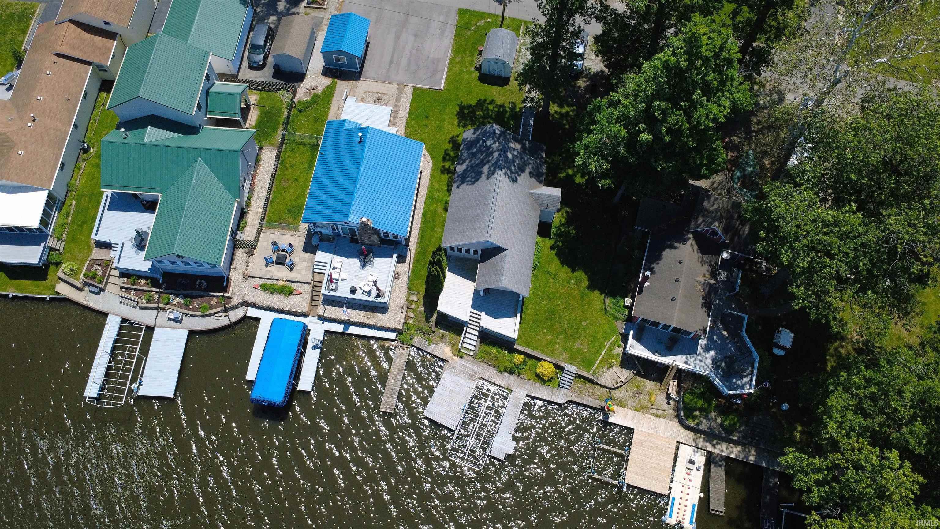 Image 2: Waterfront properties featuring private docks and direct water access, Aerial View