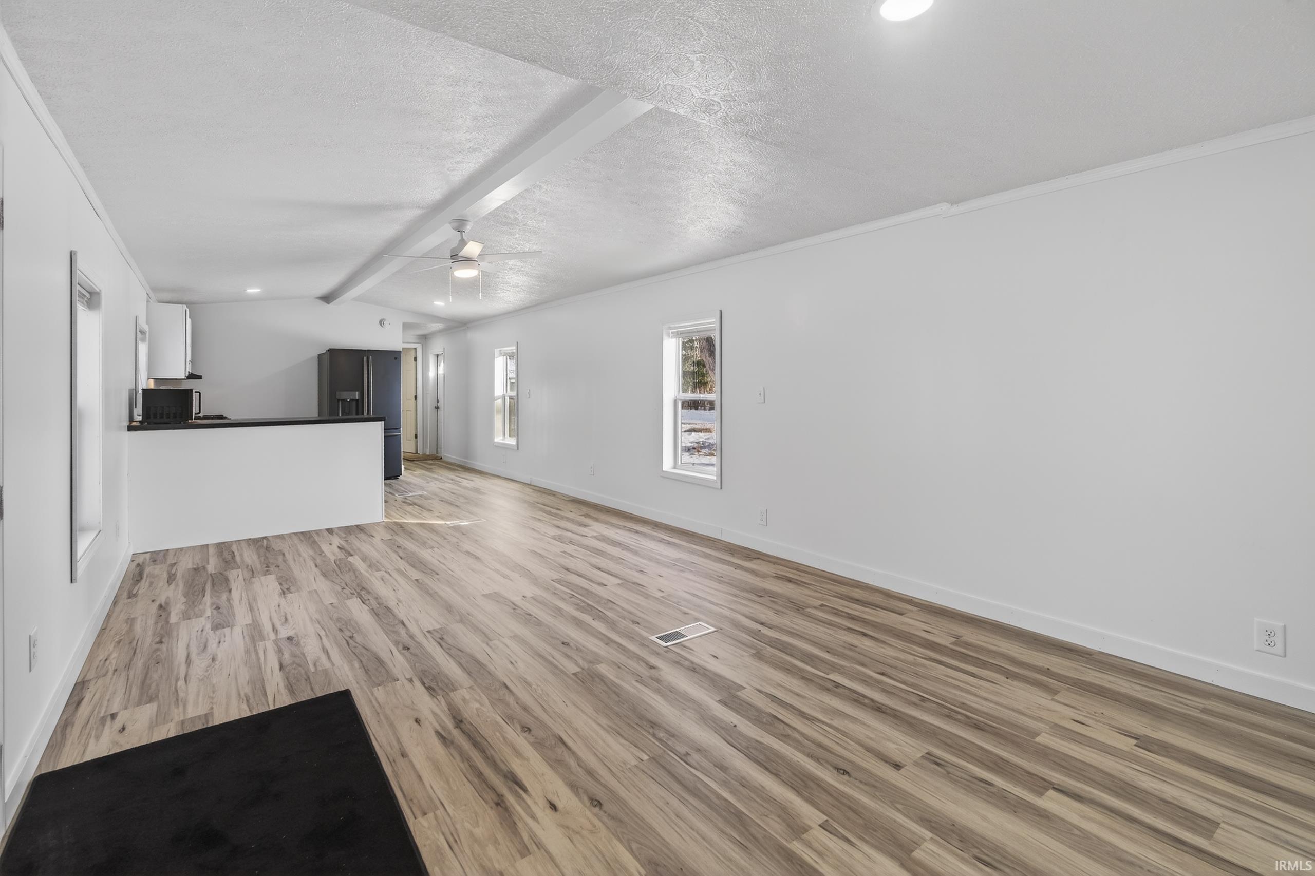 Image 1: Unfurnished living room with a ceiling fan, light wood-style flooring, and recessed lighting, Living Room