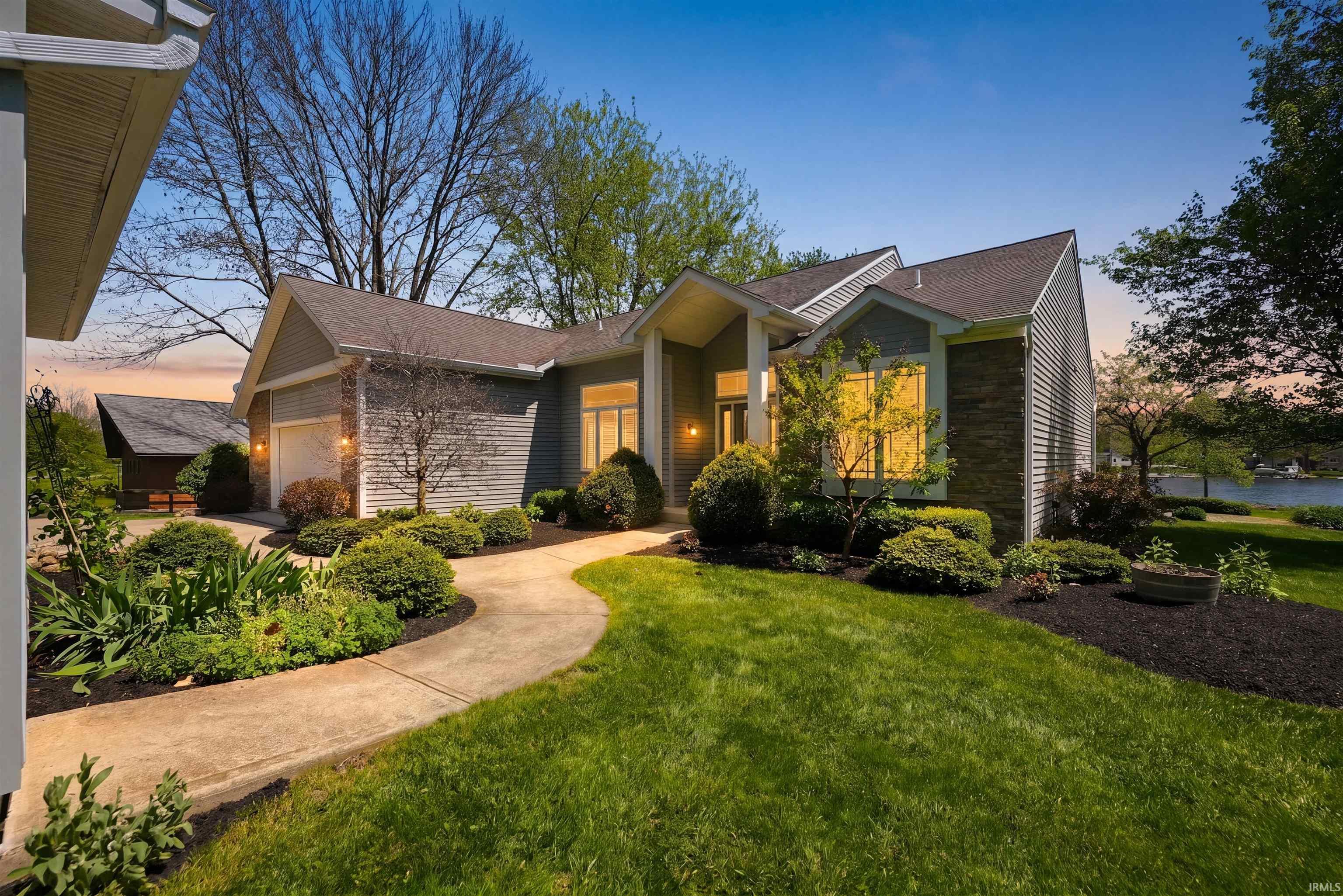 Image 0: Contemporary ranch-style residence featuring a prominent front entry with an overhang, Front Of Structure Image 0: Contemporary ranch-style residence featuring a prominent front entry with an overhang, Front Of Structure