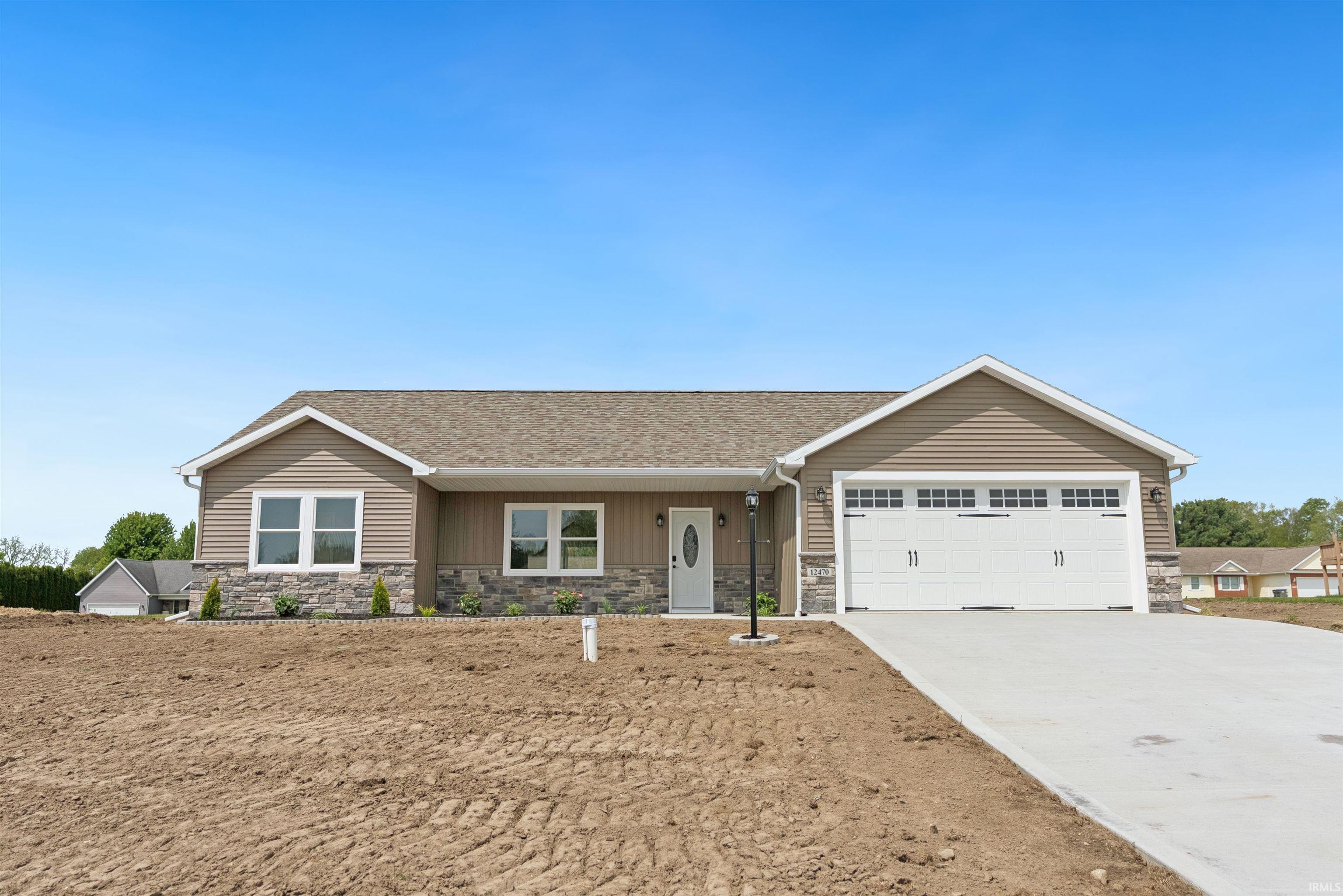 Image 1: Contemporary single-story residence featuring light brown horizontal siding with stone veneer accents, Front Of Structure