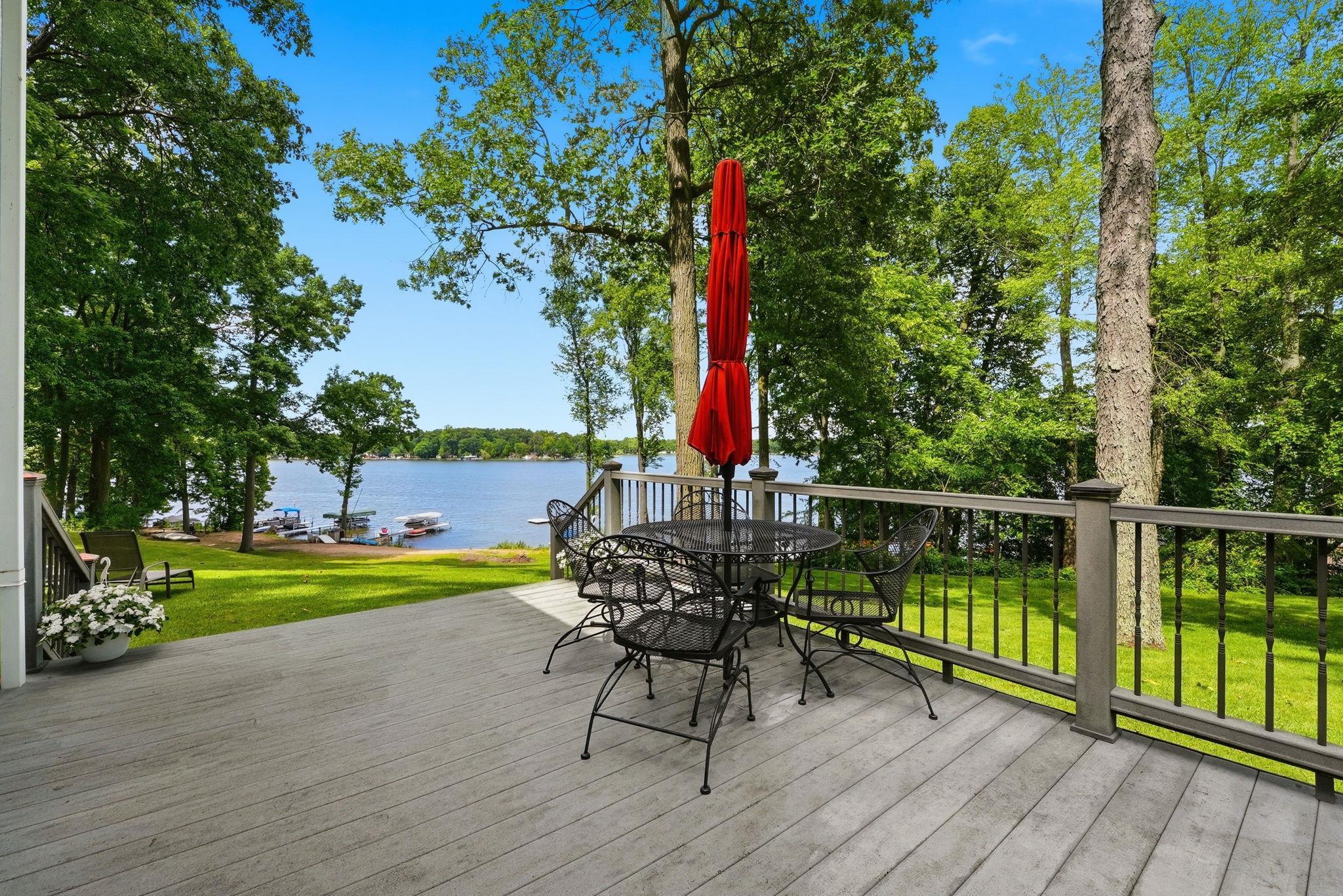 Image 2: Spacious outdoor deck with composite decking and dark railings, Deck Image 2: Spacious outdoor deck with composite decking and dark railings, Deck