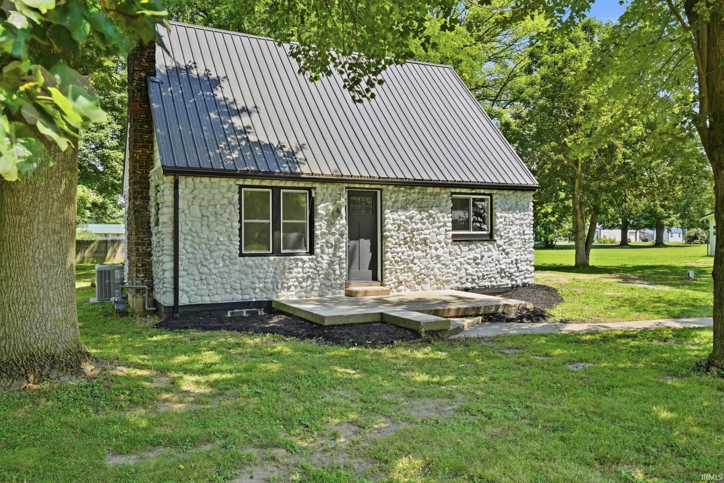 Image 0: Stone-clad exterior featuring a dark metal roof, Front Of Structure Image 0: Stone-clad exterior featuring a dark metal roof, Front Of Structure