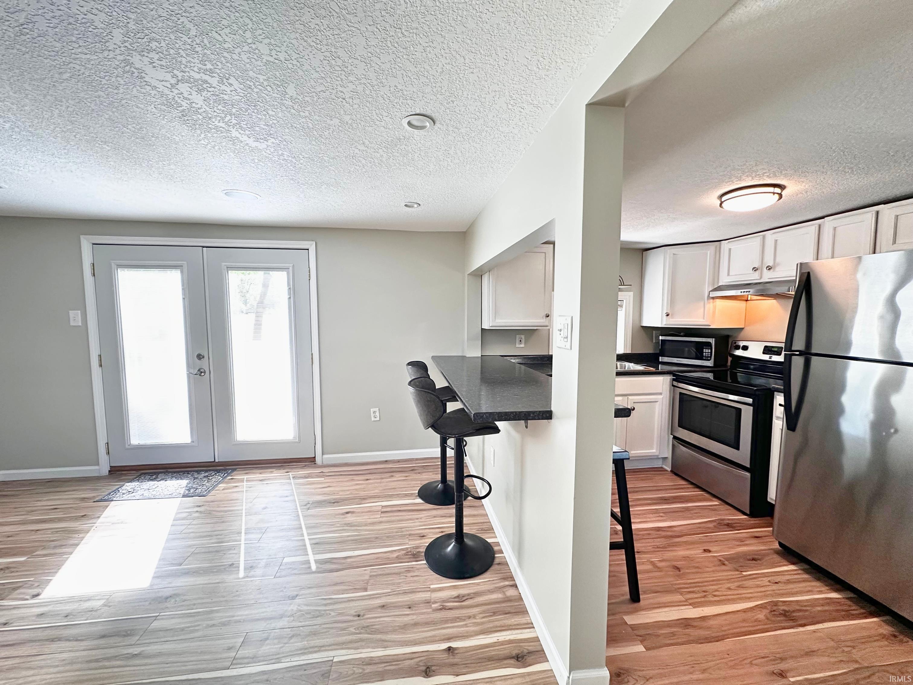 Image 3: Kitchen featuring the breakfast nook, which is perfectly located! If you are entertaining inside, the open floor-plan allows any hostess to engage while prepping any meal!, Breakfast Bar Image 3: Kitchen featuring the breakfast nook, which is perfectly located! If you are entertaining inside, the open floor-plan allows any hostess to engage while prepping any meal!, Breakfast Bar