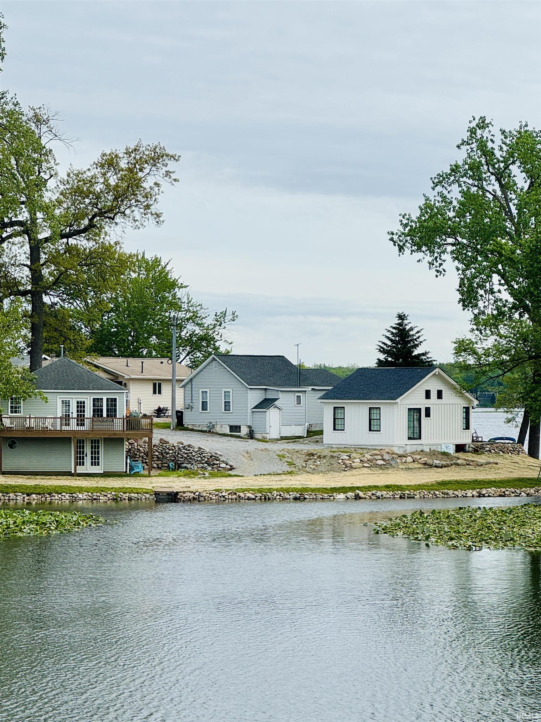 Image 2: Waterfront property featuring a private dock and a two-story deck, View Image 2: Waterfront property featuring a private dock and a two-story deck, View
