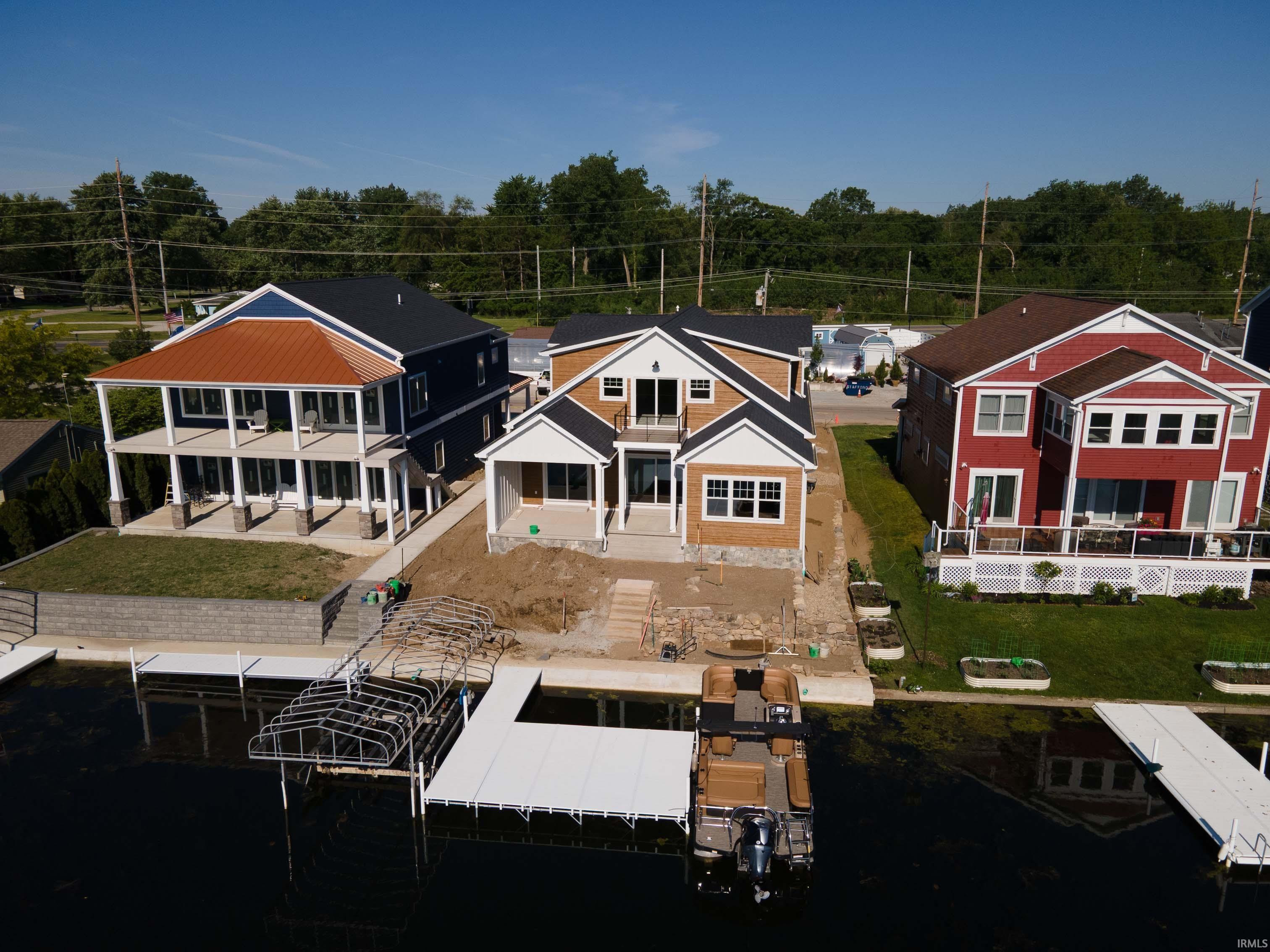 Image 3: Waterfront property featuring a new construction residence with an attached private dock, Back Of Structure Image 3: Waterfront property featuring a new construction residence with an attached private dock, Back Of Structure