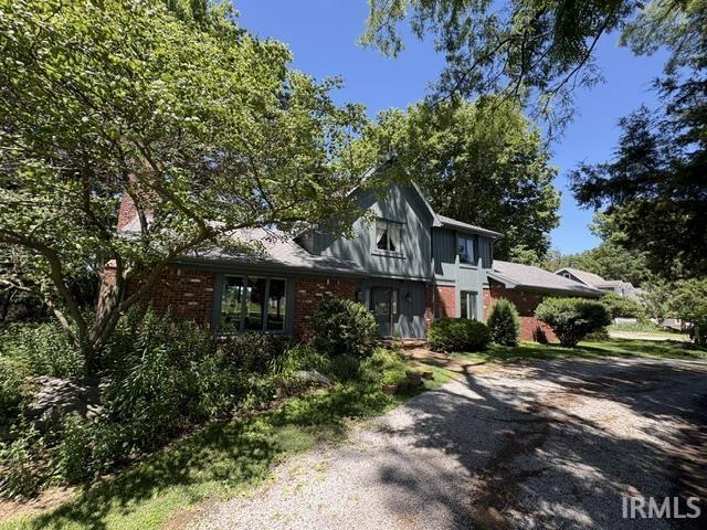 Image 1: Brick and vertical siding exterior with an asphalt shingle roof, Front Of Structure Image 1: Brick and vertical siding exterior with an asphalt shingle roof, Front Of Structure