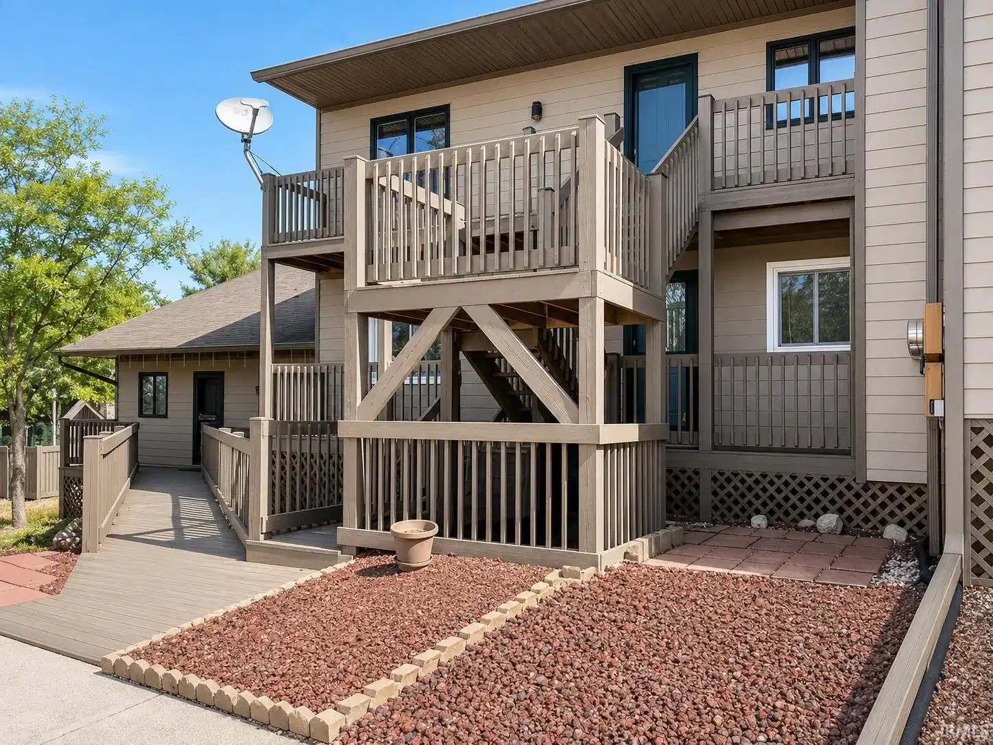 Image 0: Multi-level exterior decks with wood railings, Front Of Structure Image 0: Multi-level exterior decks with wood railings, Front Of Structure