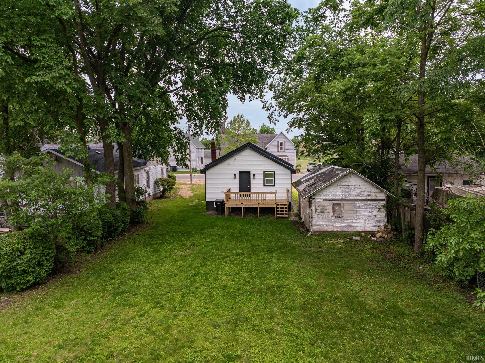 Image 3: Expansive grassy yard with mature trees, Back Of Structure Image 3: Expansive grassy yard with mature trees, Back Of Structure