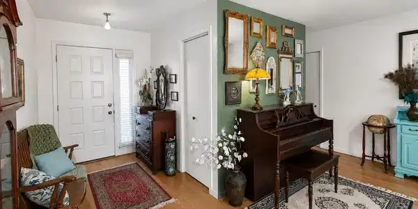 Image 3: Entryway featuring wood-finish flooring, a paneled front door with sidelight, and a recessed ceiling light, Entrance Foyer Image 3: Entryway featuring wood-finish flooring, a paneled front door with sidelight, and a recessed ceiling light, Entrance Foyer