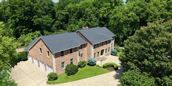 Image 1: Brick exterior with dark gray roofing, Aerial View Image 1: Brick exterior with dark gray roofing, Aerial View