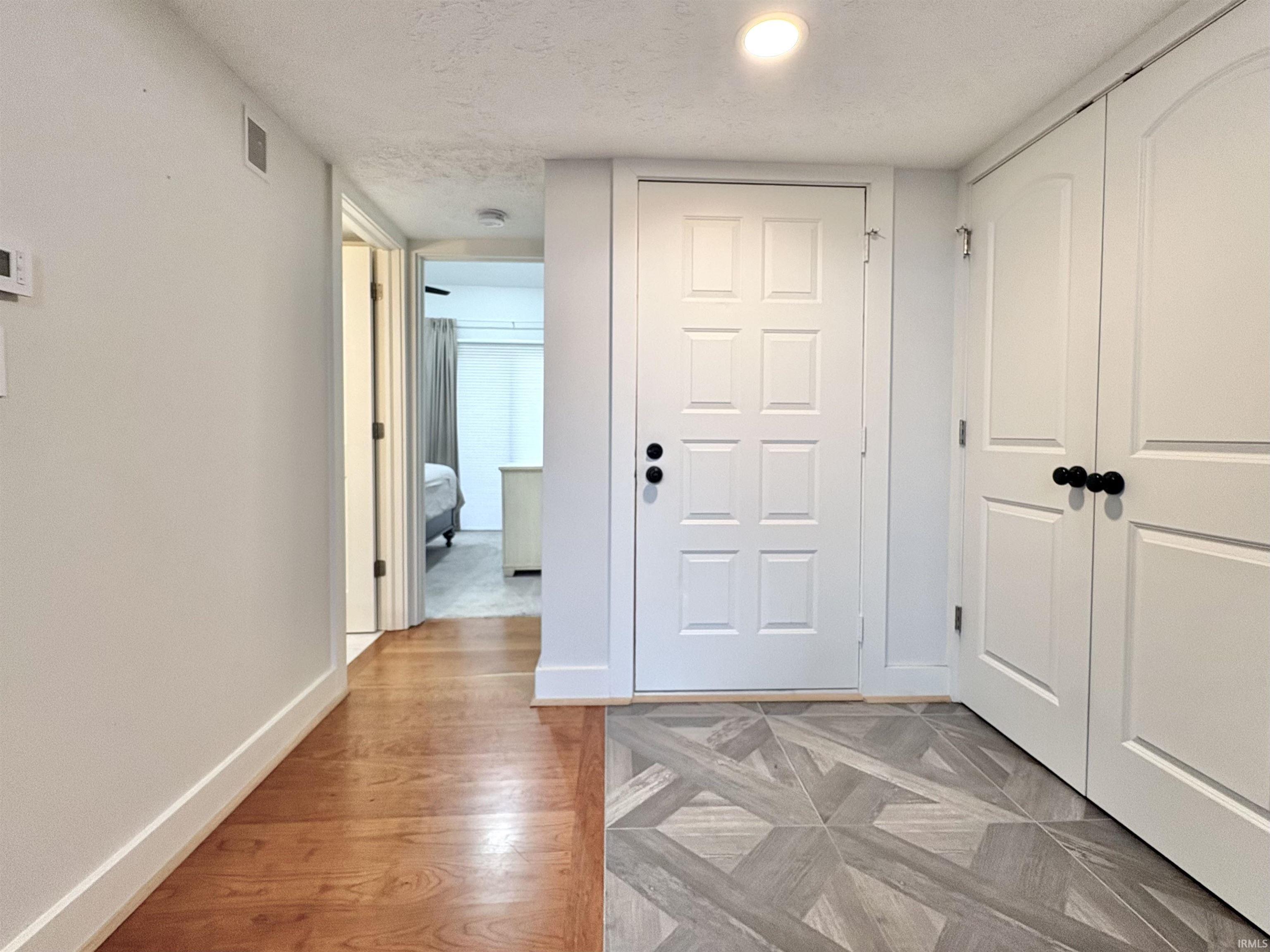 Image 2: Hallway featuring parquet floors and a textured ceiling, Hallway