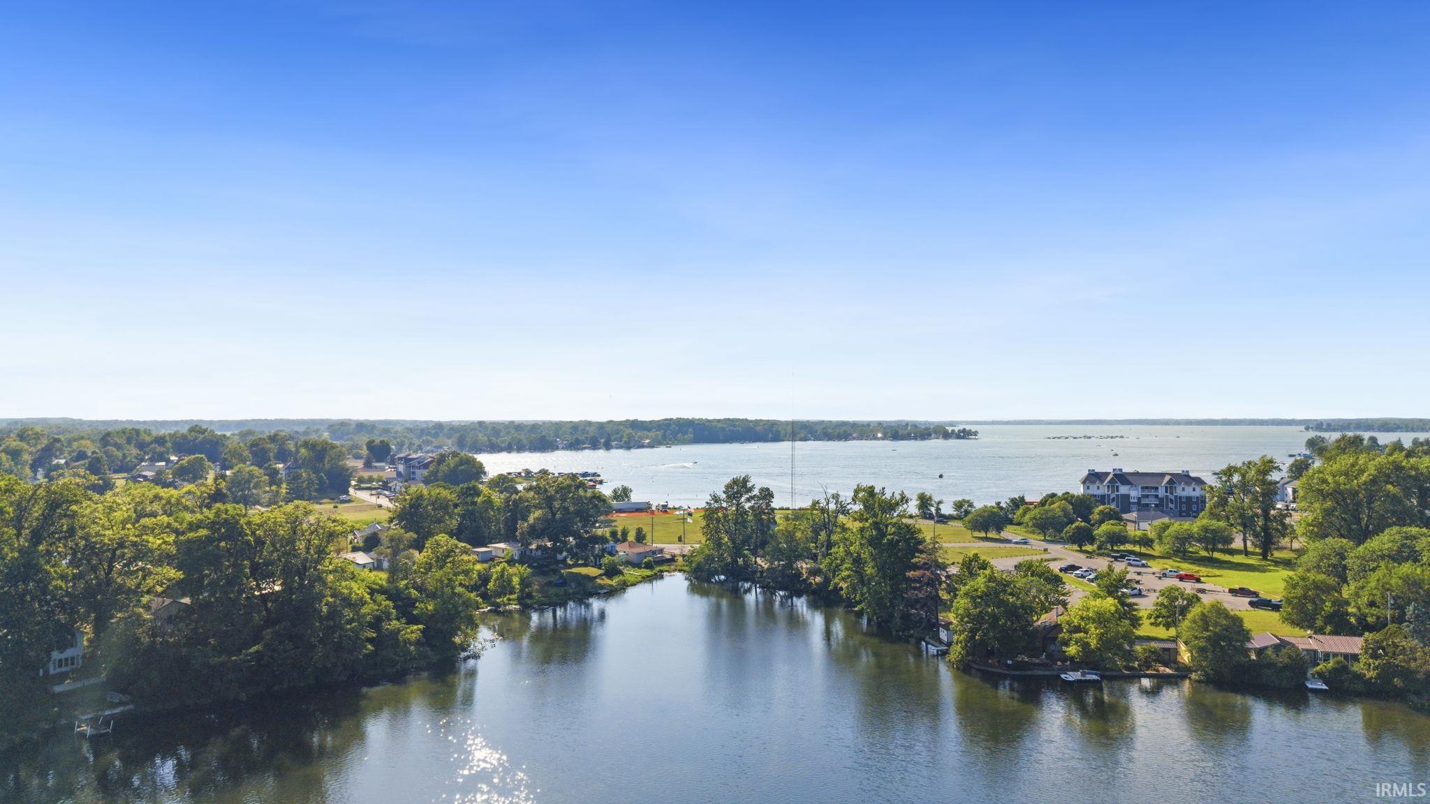 Image 2: Expansive waterfront setting featuring a tranquil canal leading to a large body of water, View Image 2: Expansive waterfront setting featuring a tranquil canal leading to a large body of water, View