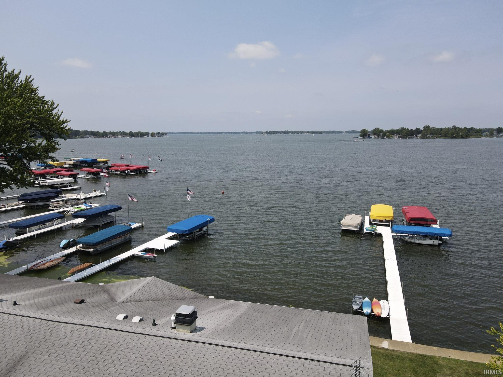 Image 2: Expansive water frontage featuring multiple boat slips and docks, Dock Image 2: Expansive water frontage featuring multiple boat slips and docks, Dock