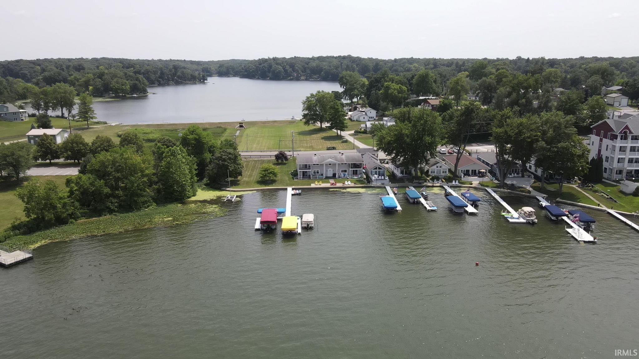 Image 3: Expansive lakefront property featuring multiple boat docks, Aerial View Image 3: Expansive lakefront property featuring multiple boat docks, Aerial View
