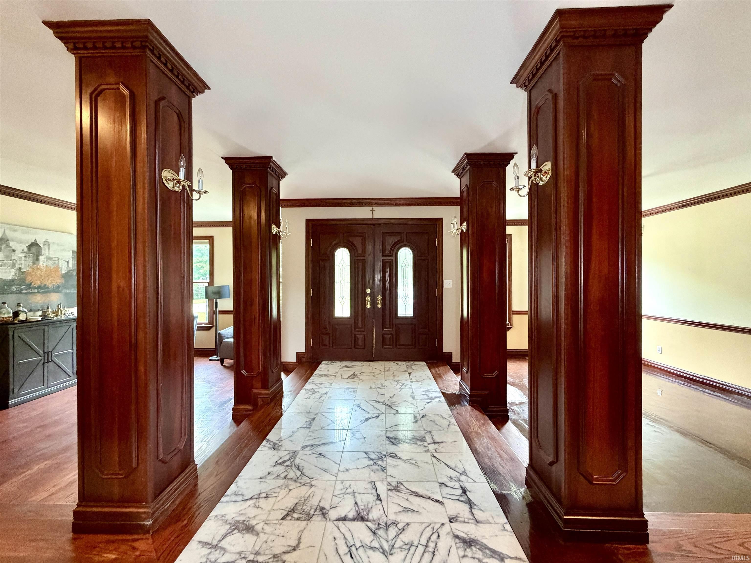 Image 3: Grand entry foyer featuring a double-door entry, decorative transom, and sidelights, Entrance Foyer Image 3: Grand entry foyer featuring a double-door entry, decorative transom, and sidelights, Entrance Foyer