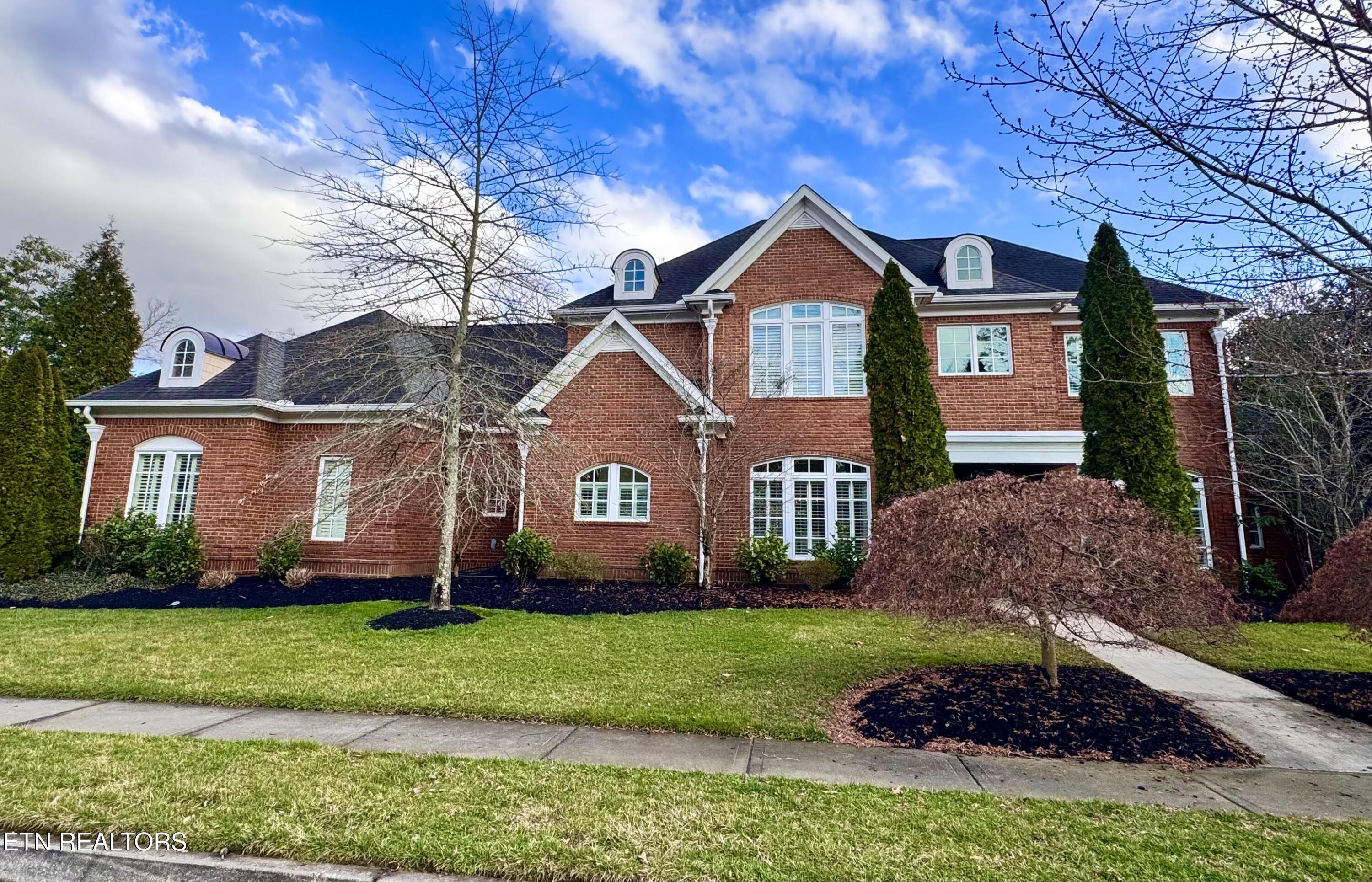 Image 1: All Brick Executive home