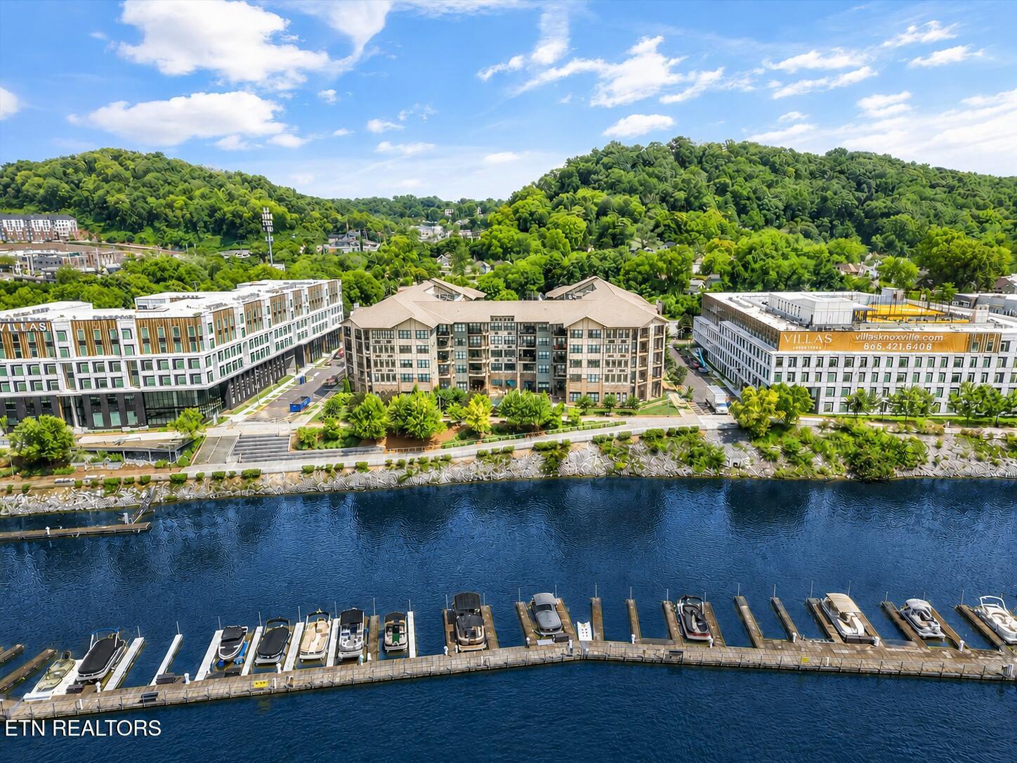Image 4: Drone view of building and marina