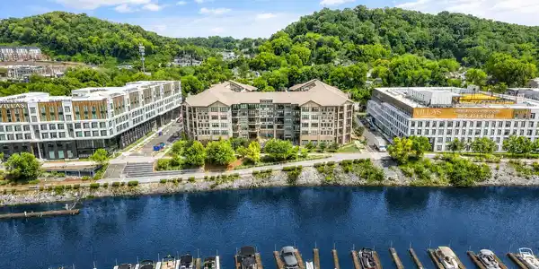 Image 4: Drone view of building and marina