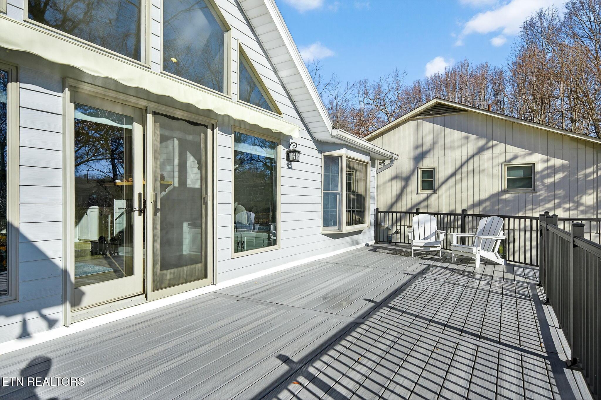 Image 4: Large deck overlooking the lake