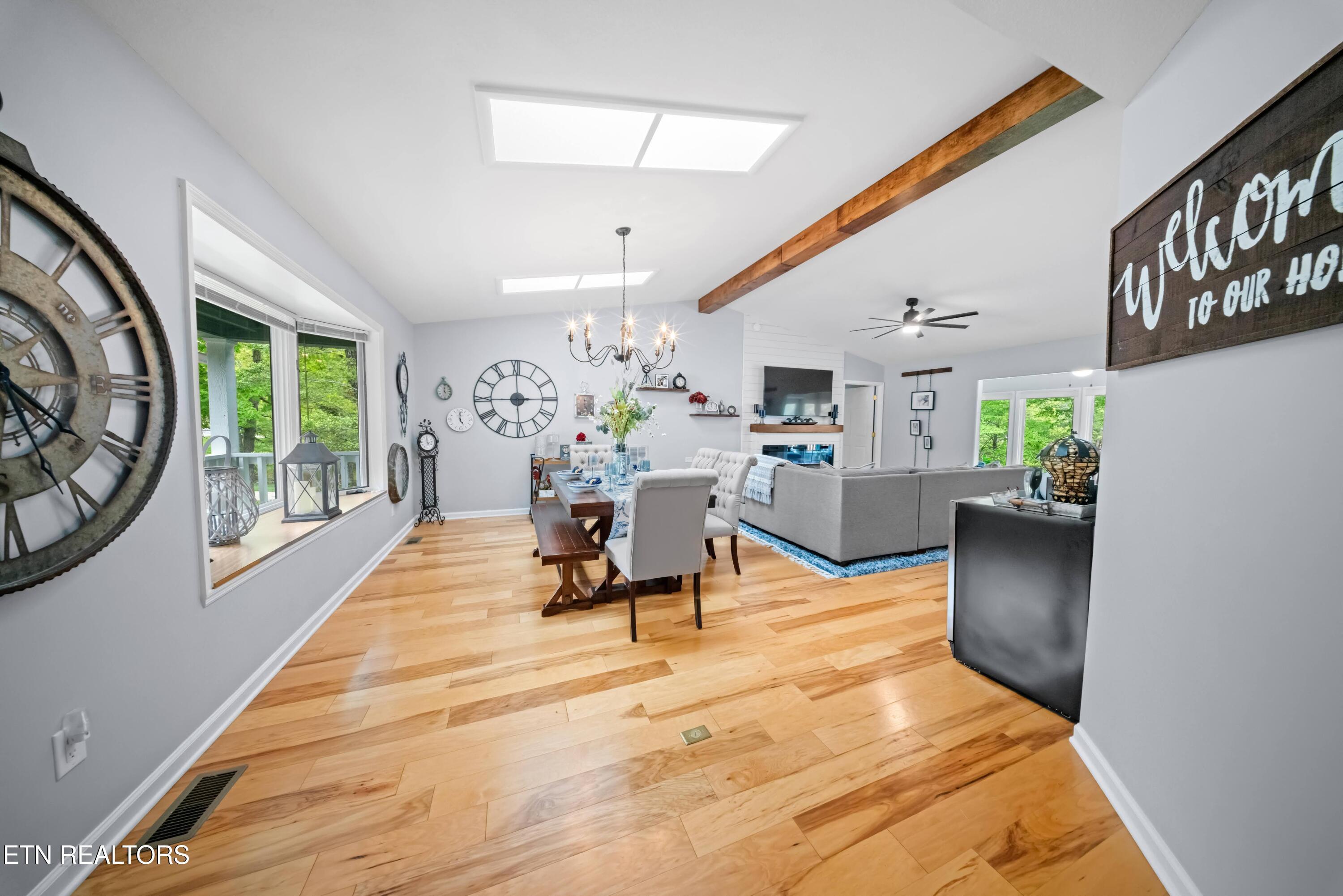 Image 4: View of Dining/Living From Foyer