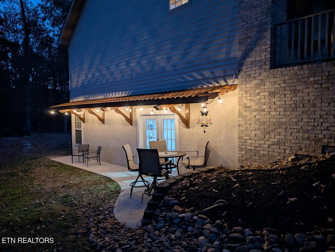 Image 4: J Pergola patio at dusk