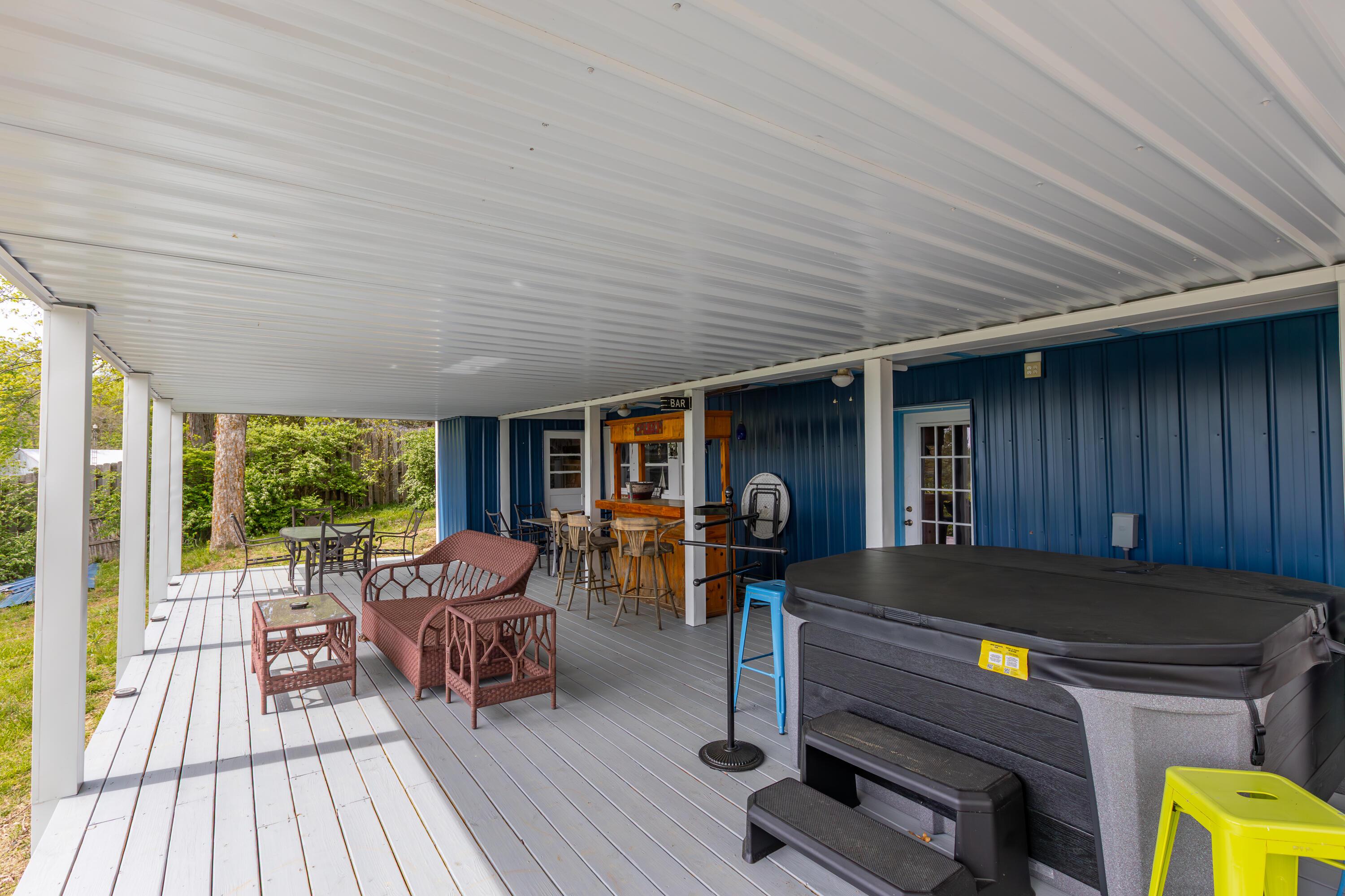 Image 3: Lower Deck with Bar & Hot Tub