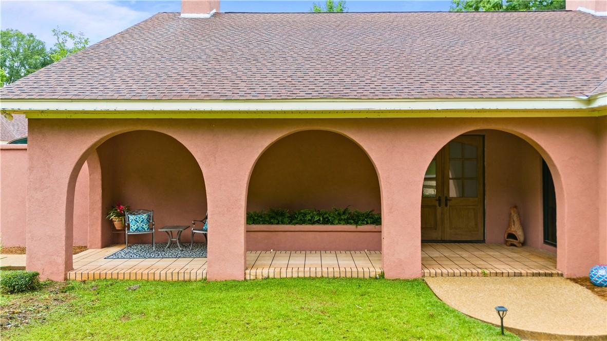 Image 3: Veranda has a beautiful tin ceiling, a planter box