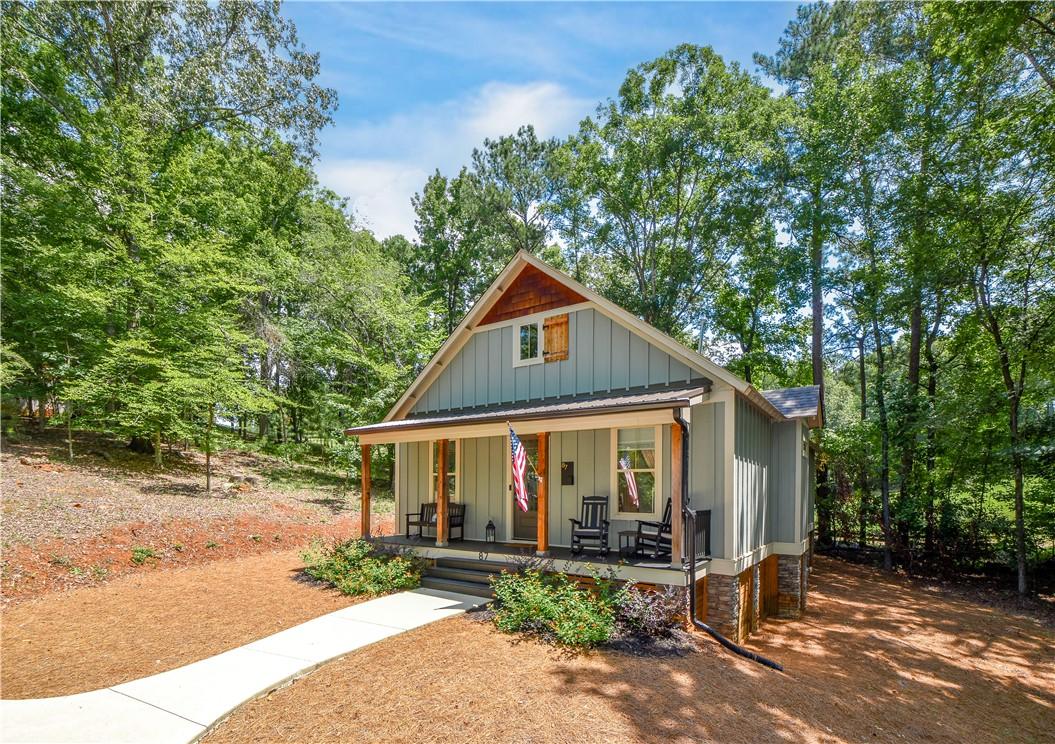 Image 1: A charming cottage facade featuring a welcoming fr