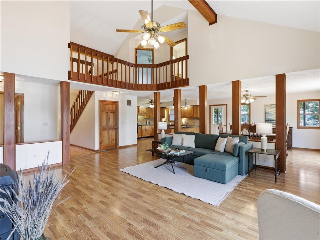 Image 4: The great room features soaring vaulted ceilings,