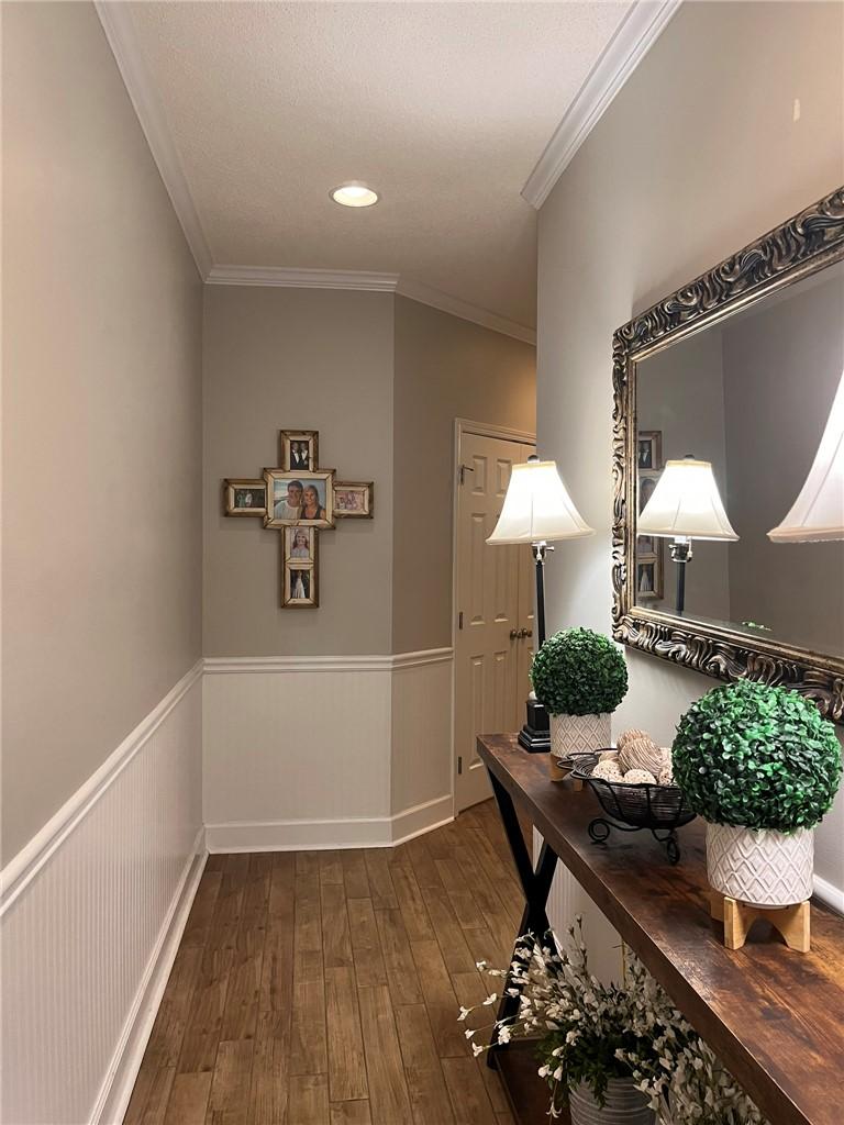 Image 4: Clean lines and wood-look flooring create a welcom