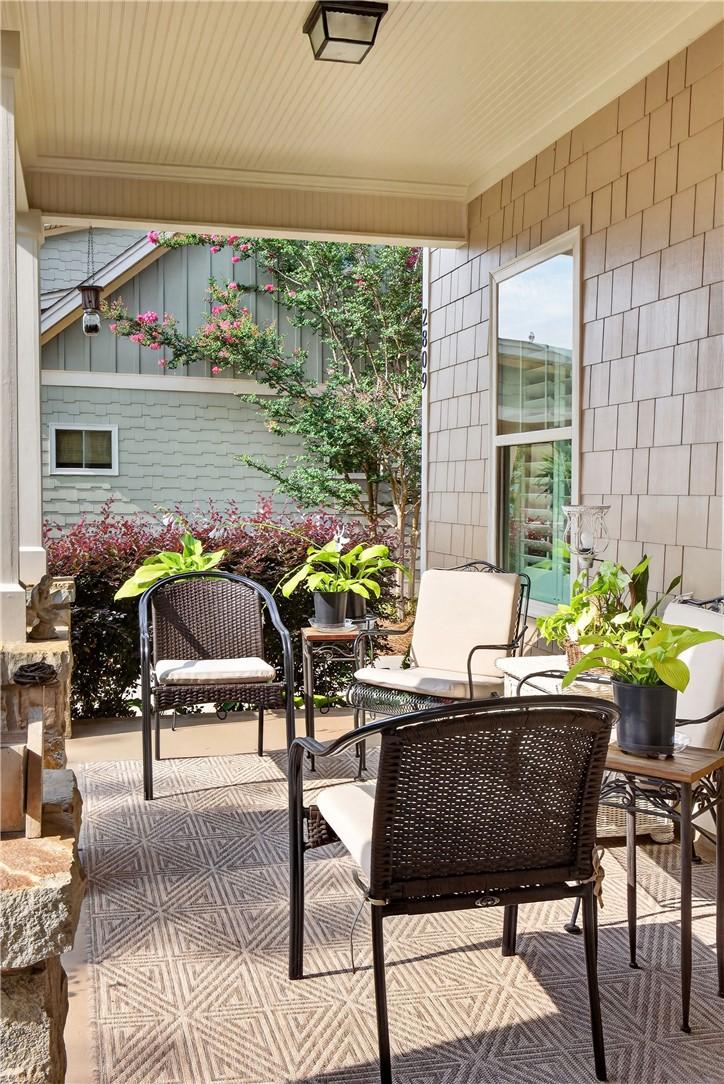 Image 3: An inviting covered porch offers a serene spot for