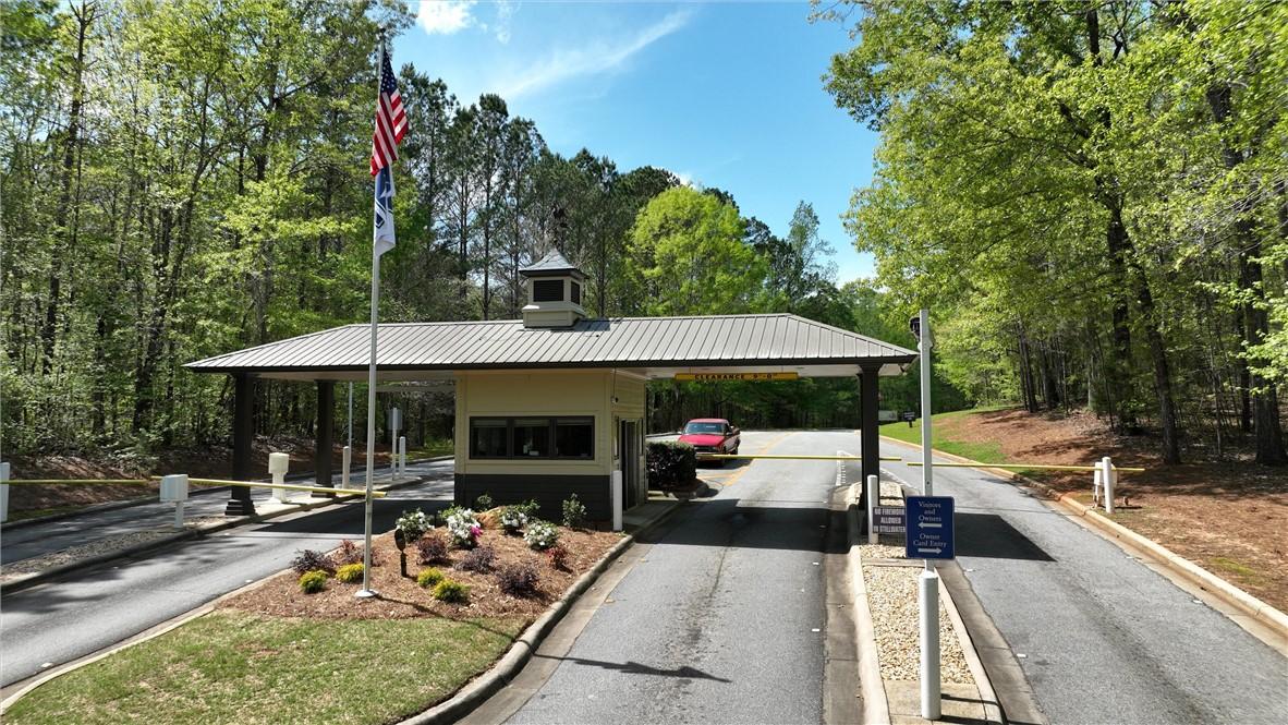 Image 2: A secure gated entry welcomes residents, framed by