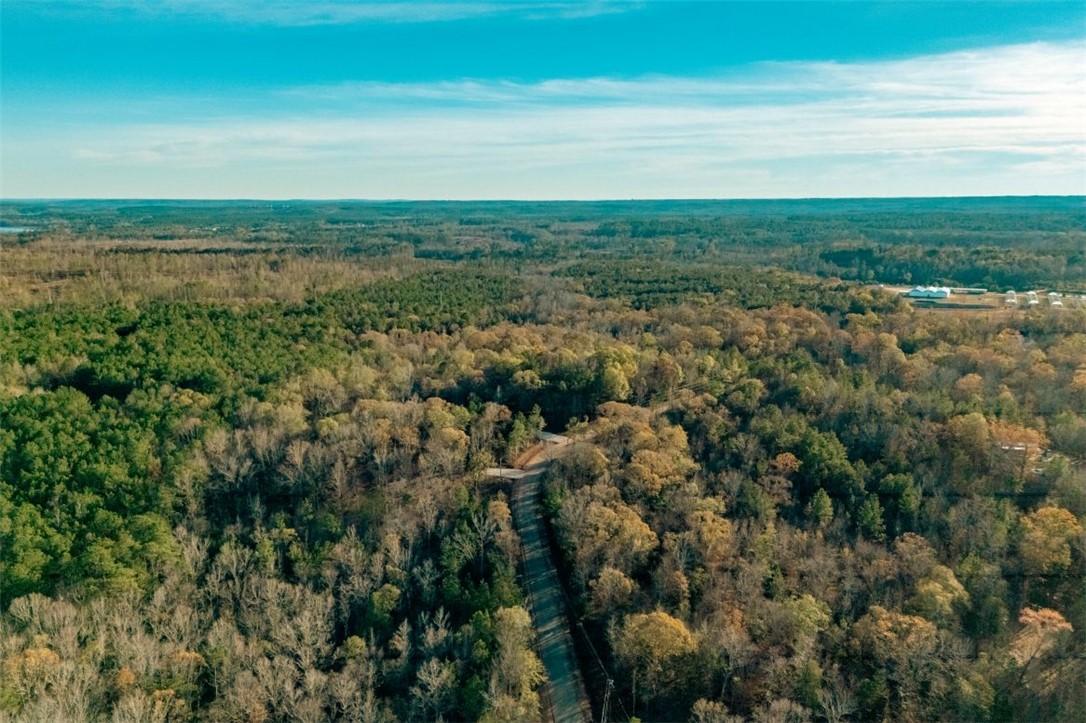 Image 4: A winding private road meanders through a vast exp