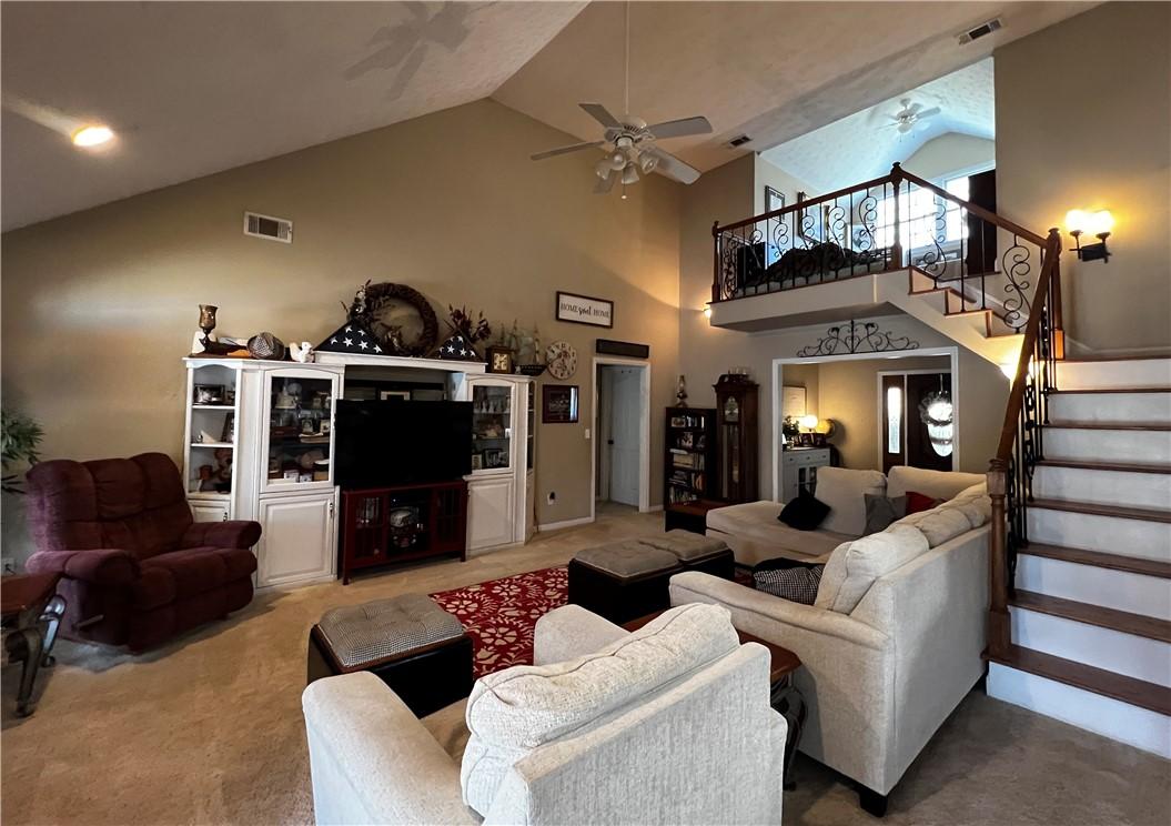 Image 4: The soaring ceilings and open layout create a spac