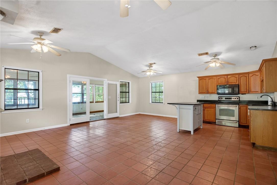 Image 4: This expansive space integrates living and cooking