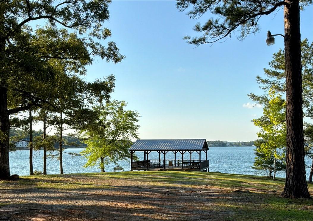 Image 3: This serene lakeside gazebo offers picturesque wat